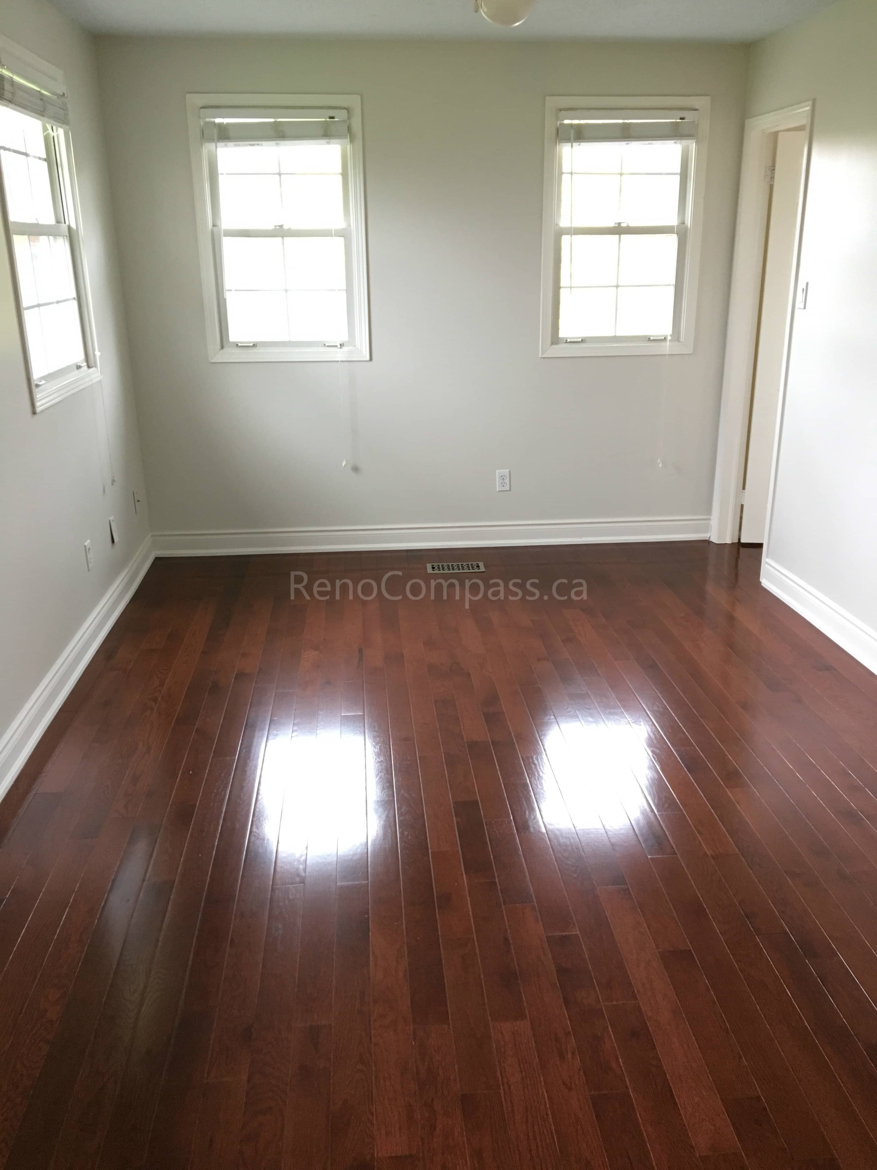 This Mississauga interior renovation features newly installed dark hardwood flooring, fresh neutral wall paint, and upgraded trim finishes that create a bright and welcoming living space. Completed by a professional Toronto renovation company, the renovation enhances durability, visual warmth, and overall home value while delivering a clean, modern interior suitable for everyday living.