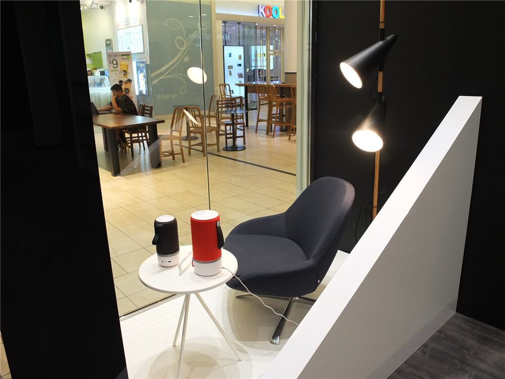 Retail interior renovation inside Markville Mall featuring a modern customer experience corner with lounge seating, designer lighting, and minimalist product display. The space is designed to create a comfortable and interactive environment where customers can explore products in a relaxed setting. This commercial renovation highlights how thoughtful retail interior design can enhance customer engagement while maintaining a sleek and contemporary store aesthetic in a Toronto shopping mall.