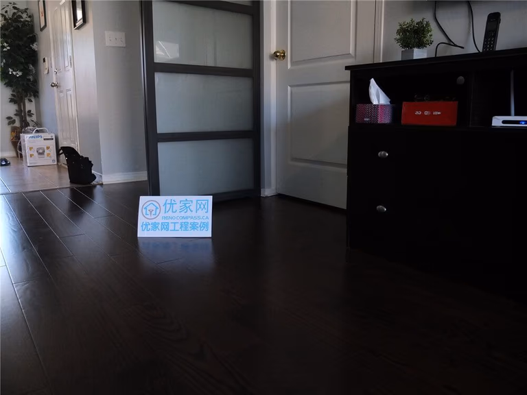 This image showcases the completed dark hardwood flooring installation in a Mississauga home renovation project. The rich wood tones and clean plank alignment create a modern and elegant interior atmosphere that enhances both durability and visual appeal. As a professional Toronto Renovation Company, Reno Compass specializes in high-quality flooring renovations designed to improve comfort, functionality, and long-term home value.