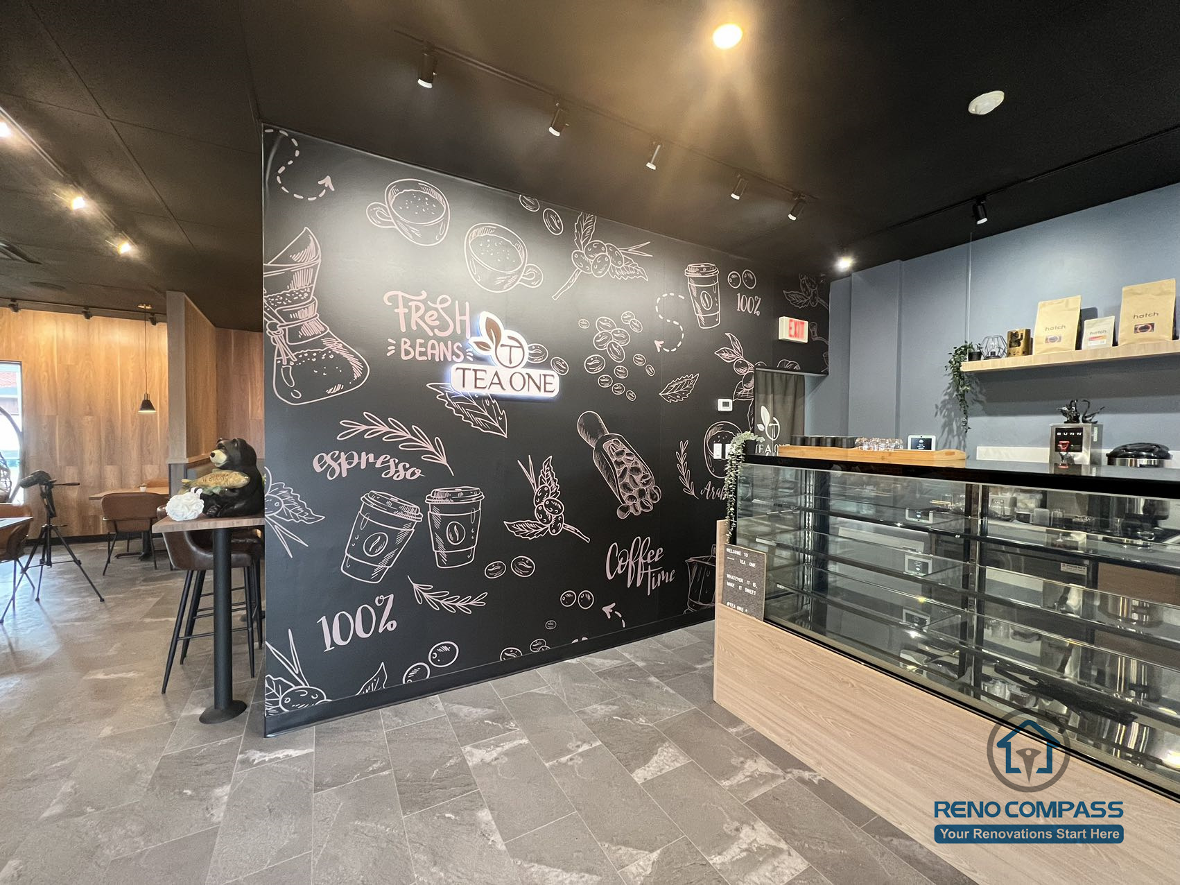 This Mississauga restaurant renovation highlights a custom feature wall with graphic artwork and a modern front service counter. The design strengthens brand identity while creating a clear, welcoming customer flow at the point of order.