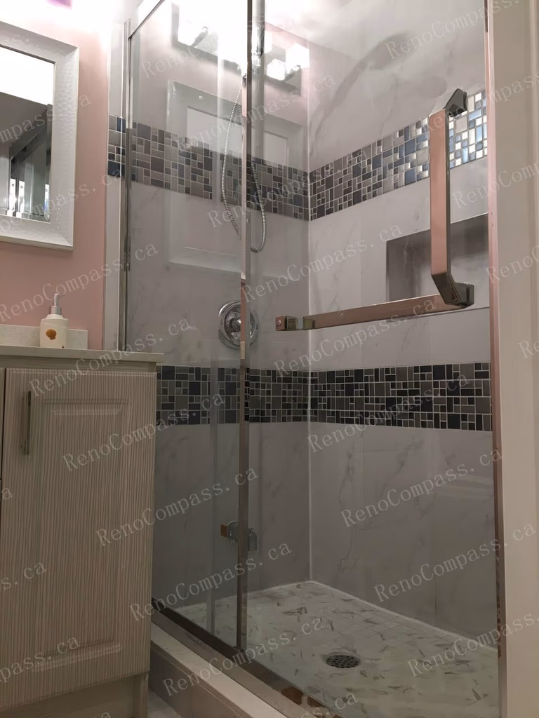 This Mississauga basement renovation features a fully upgraded bathroom with a modern glass-enclosed shower, stylish tile backsplash, and contemporary vanity. Completed by an experienced Toronto renovation company, the bathroom design combines durability, comfort, and clean aesthetics, perfectly complementing the one-bedroom basement layout for everyday living or rental use.