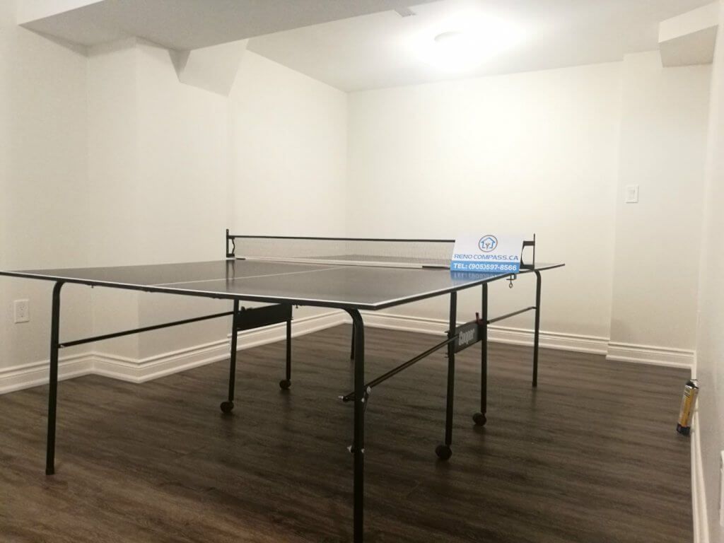 This Markham basement renovation transforms an underused space into a clean and functional multi-purpose entertainment area. The finished basement features durable wood-look flooring, smooth white walls, upgraded lighting, and an open layout suitable for games, family activities, or home recreation. Completed by a professional Toronto renovation company, this basement renovation focuses on comfort, flexibility, and long-term usability for everyday living.