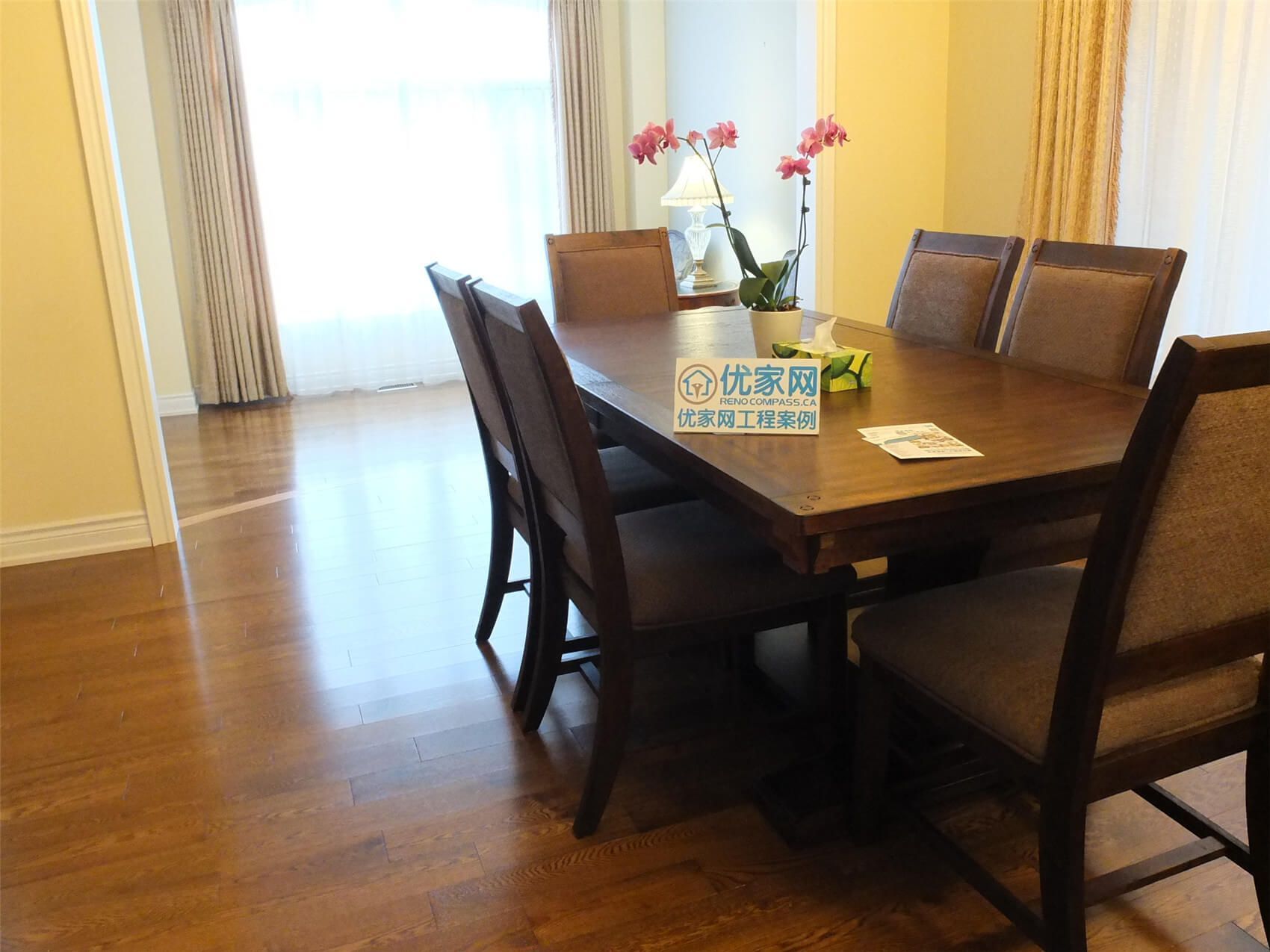 This Aurora flooring renovation project features beautifully refinished hardwood flooring that enhances the warmth and elegance of the dining area. The upgraded wood floor provides a smooth, durable surface that complements the dining table, chairs, and natural lighting from the large window. Completed by a professional Toronto renovation company, the flooring installation improves both aesthetics and long-term functionality of the space.
