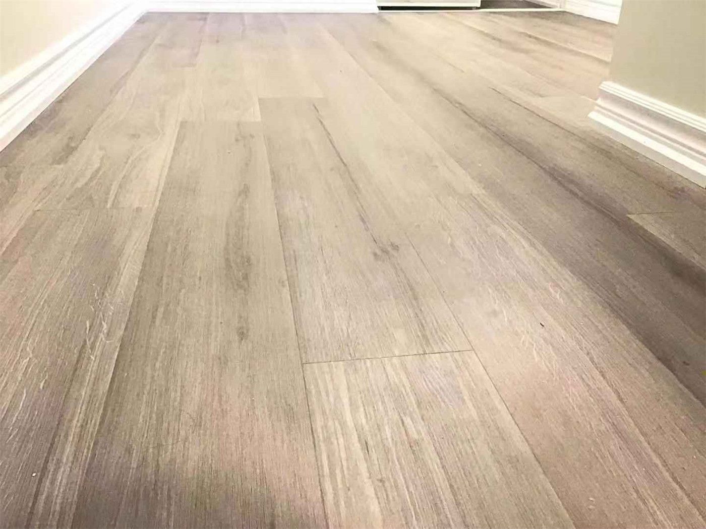 This Scarborough basement renovation features high-quality light wood-look flooring, creating a warm, clean, and modern living environment. The seamless installation enhances durability, moisture resistance, and overall aesthetic appeal, making it ideal for basement spaces. Completed by a professional Toronto Renovation Company, this project highlights both functionality and elegant design.