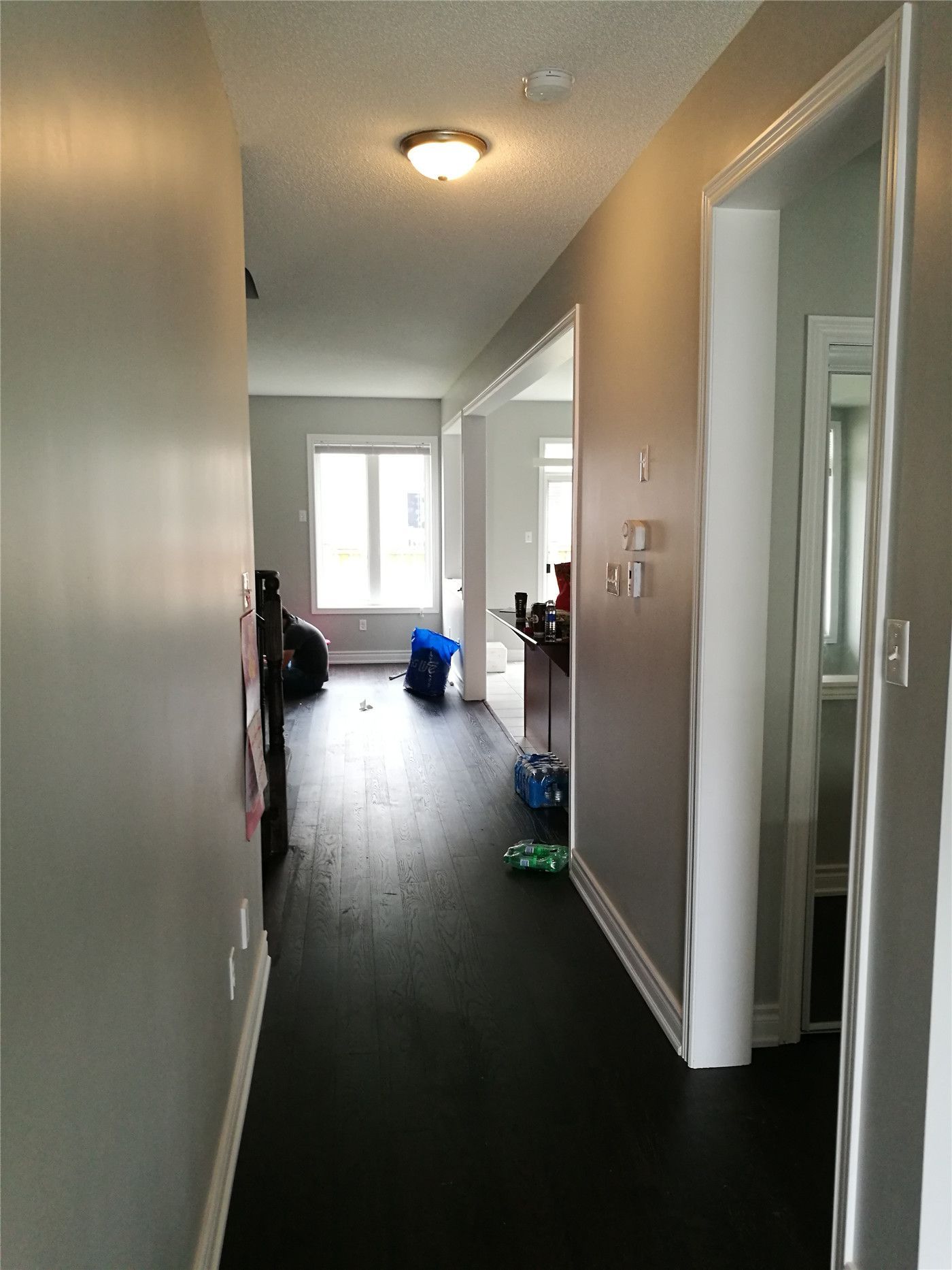 This image showcases a hallway entrance after a Markham interior renovation, featuring clean wall finishes, upgraded doors.