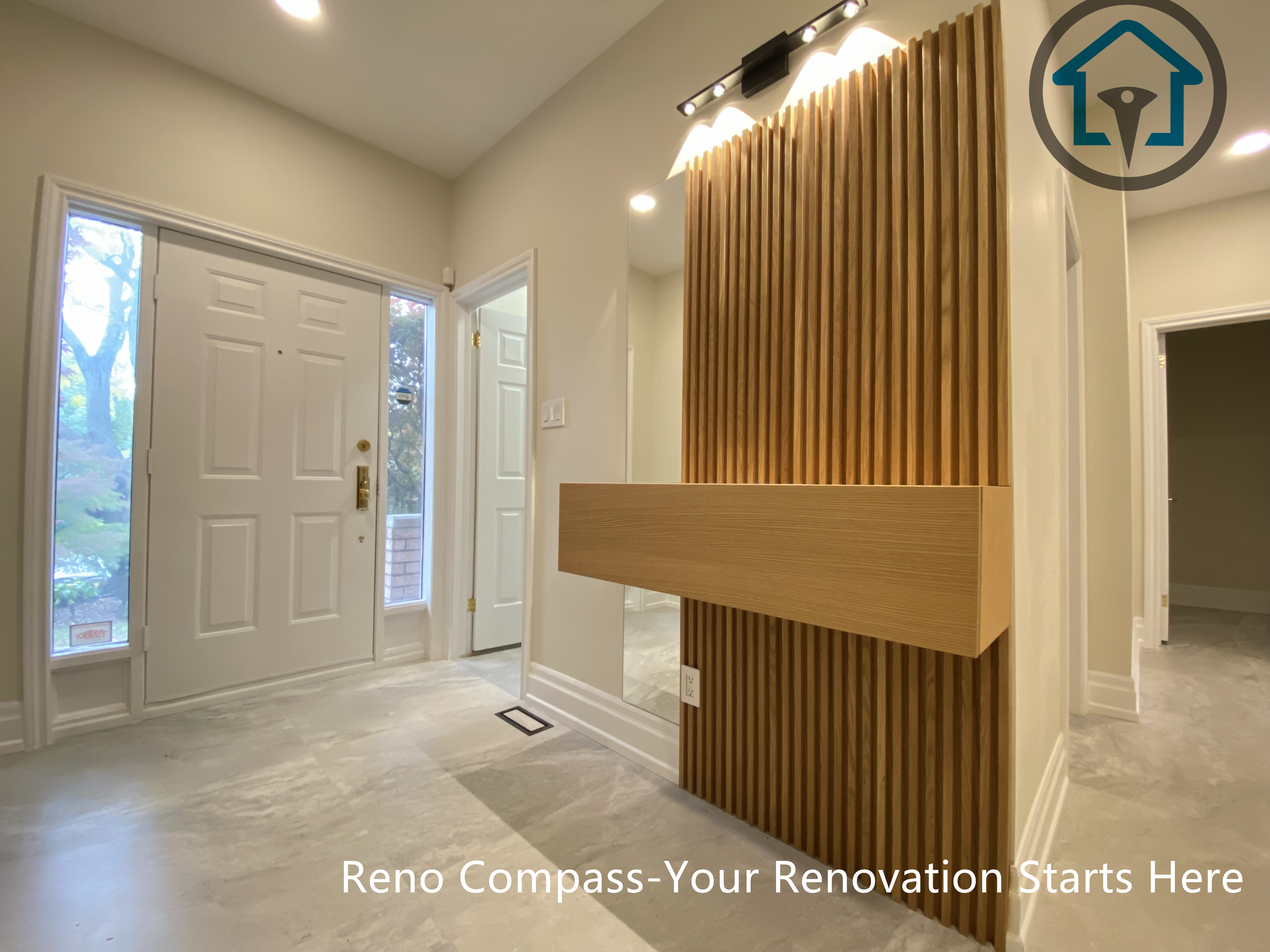 This custom wood slat feature wall adds warmth and architectural character to the home’s entryway. Designed as part of a modern Thornhill home renovation, the vertical wood detailing enhances depth, lighting balance, and first-impression impact. Completed by Reno Compass.