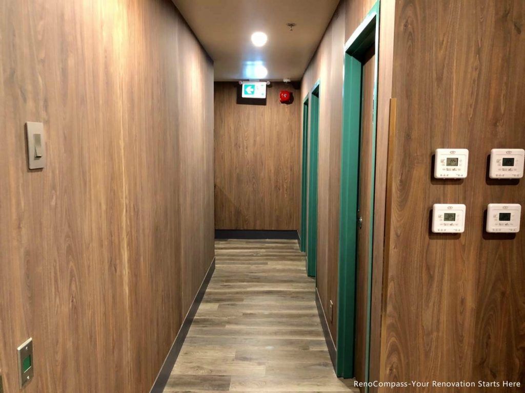 This Barrie commercial renovation features a finished interior hallway with custom wood wall panels, durable flooring, and modern lighting installation. The clean corridor layout enhances both functionality and customer flow within the commercial space. Completed by Reno Compass Inc., a professional Toronto renovation company, this project demonstrates high-quality craftsmanship for bubble tea shops, retail stores, and commercial interiors across Barrie and the GTA.