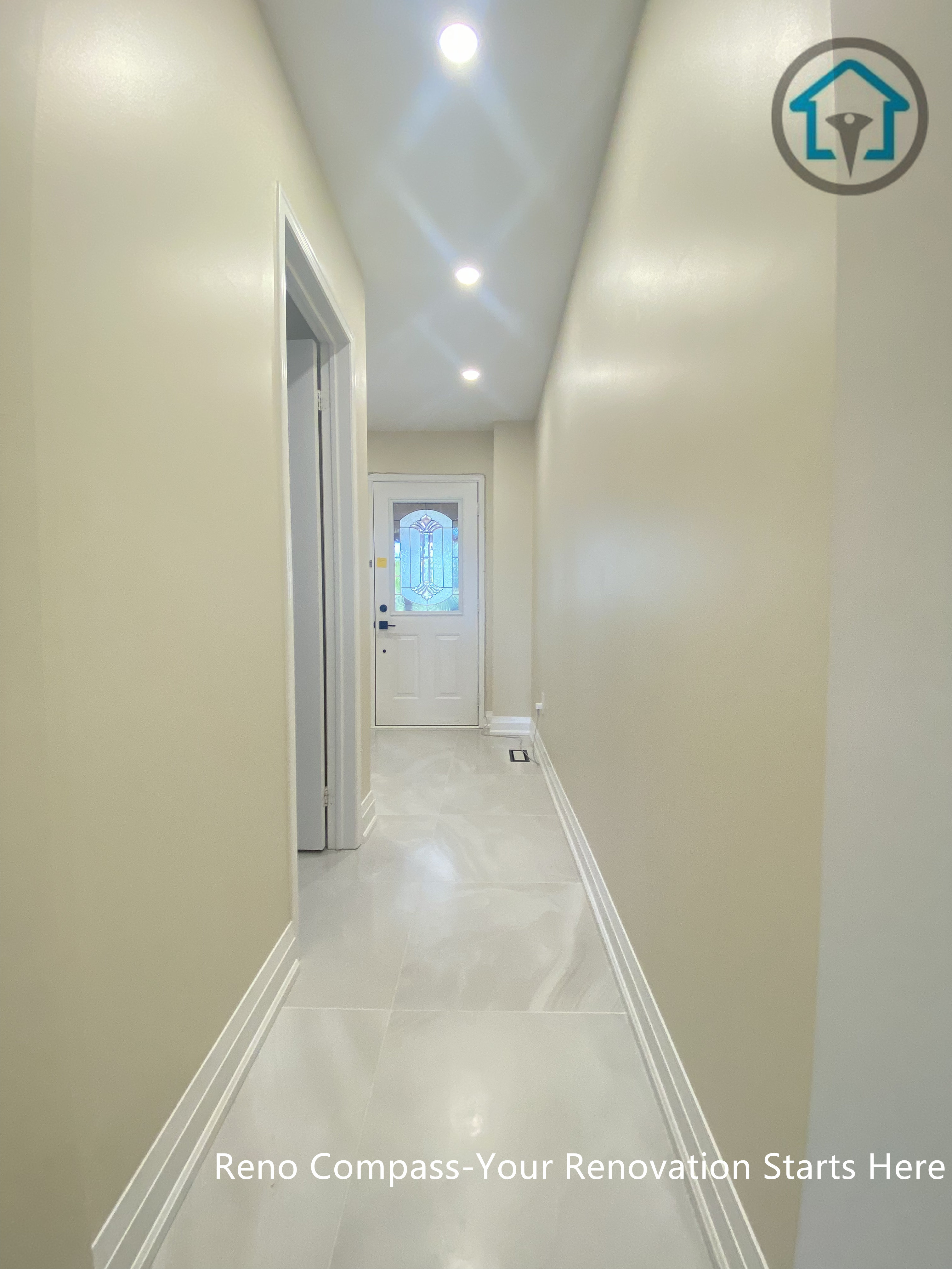 Hallway view from a completed interior renovation project in Vaughan, showing a clean and streamlined circulation space by Reno Compass.