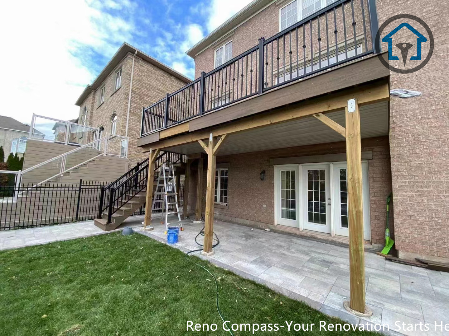 This image showcases a residential interlocking walkway and patio paving project in Oakville. The stone pattern creates a smooth transition between driveway, entrance, and outdoor living areas, improving both functionality and aesthetics. A professional paving solution completed by Reno Compass Inc.
