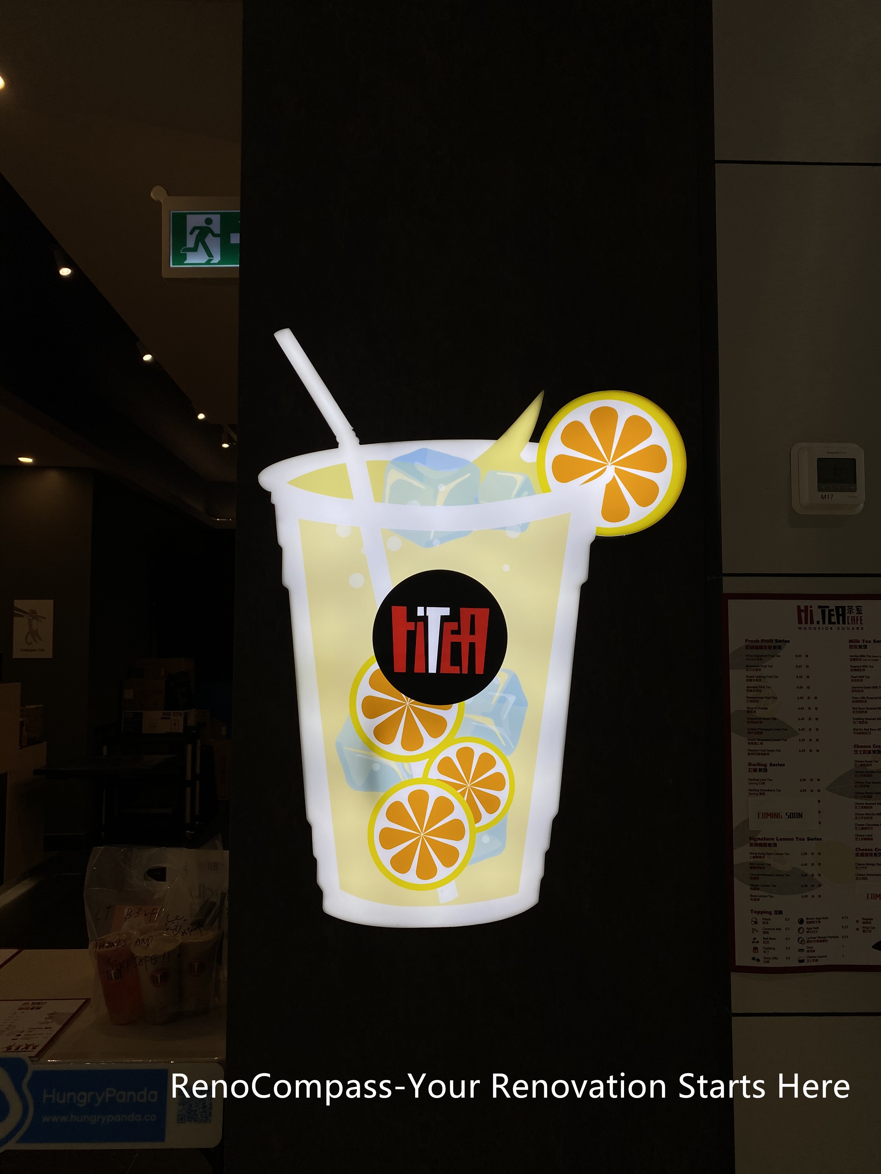 Toronto restaurant renovation featuring a branded drink display and decorative interior detail integrated into the commercial space. This project by Reno Compass Inc. highlights attention to branding elements, lighting balance, and visual accents that enhance customer experience and reinforce restaurant identity.