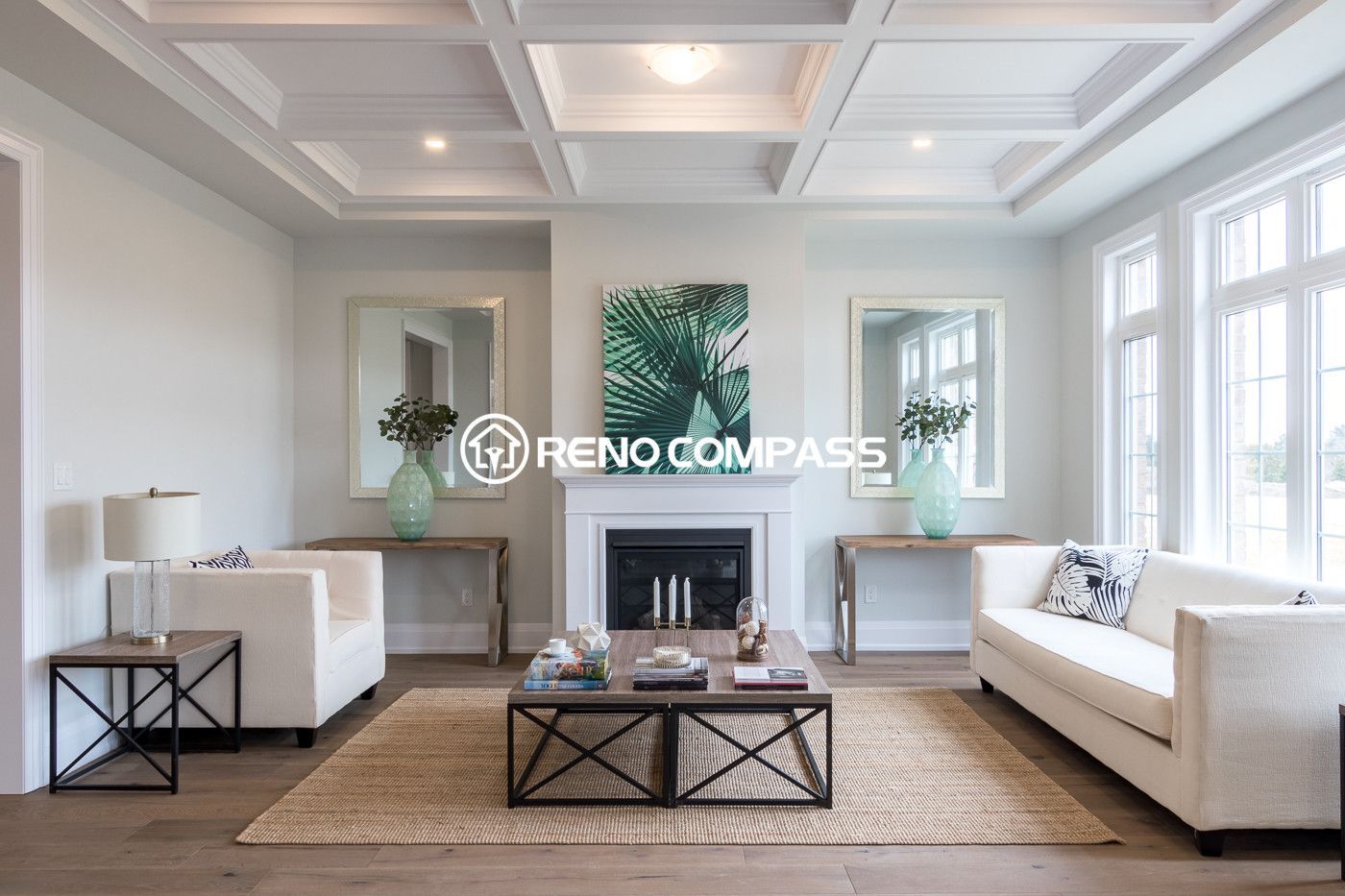 This image shows a Newmarket living room renovation featuring professionally installed engineered wood flooring. The natural wood flooring enhances the modern interior design while providing durability and stability. The project was completed by Reno Compass Inc., a Toronto renovation company specializing in flooring and interior renovations.