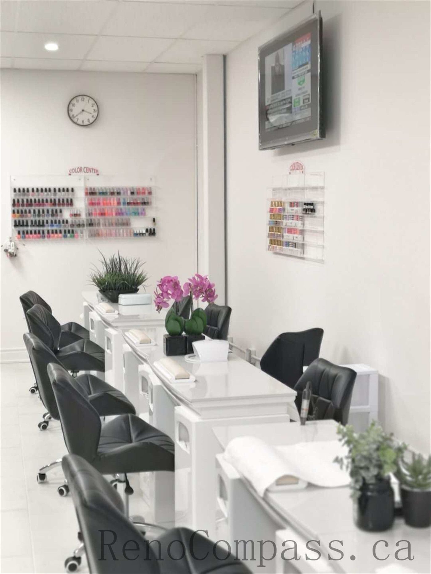Bright and modern Toronto nail spa commercial renovation featuring clean white manicure stations, ergonomic salon chairs, and a spacious open layout. This professional beauty salon interior upgrade focuses on hygiene, lighting, and efficient workstation design to enhance both customer experience and staff workflow. Commercial nail salon renovation completed by Reno Compass Inc., a reliable Toronto renovation company specializing in retail and beauty spaces.