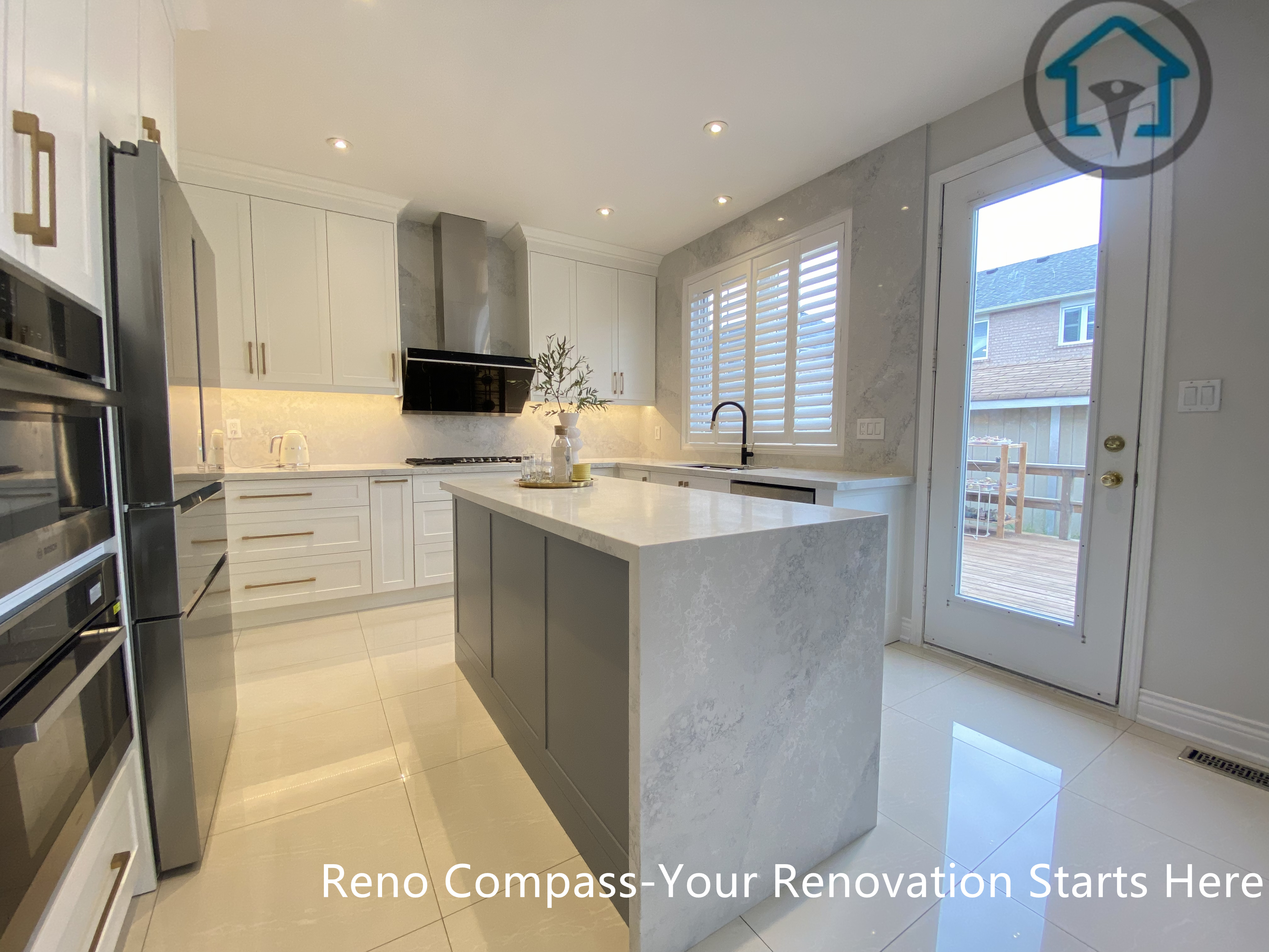 This image highlights the central waterfall island and the abundance of natural light in this Markham kitchen renovation. Positioned near large windows and a rear access door, the island becomes both a functional workspace and a visual focal point. Clean cabinetry lines, reflective flooring, and balanced lighting enhance the sense of openness and flow. Designed and completed by Reno Compass, this kitchen renovation demonstrates a thoughtful approach to space planning for modern homes in Markham.
