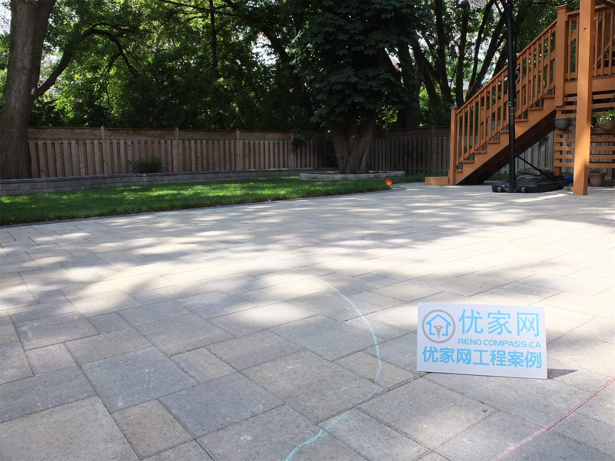 This North York landscaping renovation features a spacious backyard interlocking patio designed for durability and everyday outdoor use. Large-format pavers were installed with precise alignment to create a clean, level surface suitable for seating, circulation, and connection to the raised deck. The patio layout integrates seamlessly with the surrounding lawn, retaining walls, and mature trees, ensuring proper drainage, structural stability, and long-term performance. This project demonstrates a balanced hardscape solution that enhances backyard functionality while maintaining a refined residential landscape in North York.