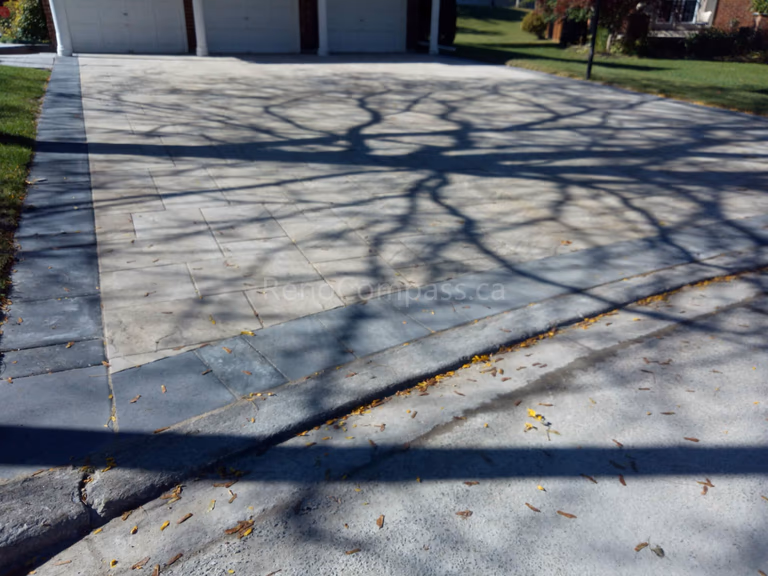 A stunning custom interlocking driveway designed and installed in Aurora by RenoCompass. Featuring precision stone alignment, clean edges, and a durable surface that enhances both function and curb appeal. Perfect for luxury homes and modern landscaping projects in the Greater Toronto Area.