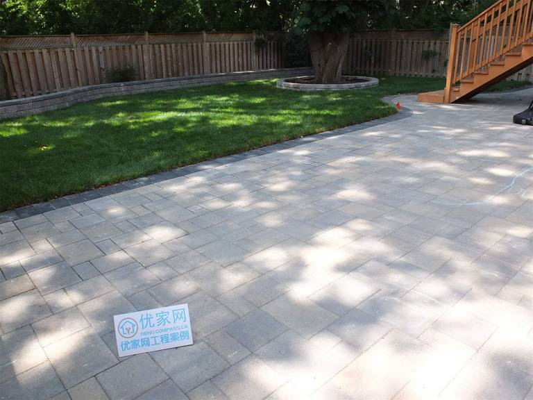 This North York backyard project features a spacious interlock patio installation designed for outdoor entertaining and relaxation. The clean, neutral-toned pavers create a durable and low-maintenance surface, seamlessly connecting the lawn area with the elevated wooden deck. The combination of hardscaping and natural greenery enhances both functionality and visual appeal. Completed by Reno Compass, this landscaping project demonstrates professional expertise in backyard patio construction, interlock paving, and residential outdoor renovation in North York.