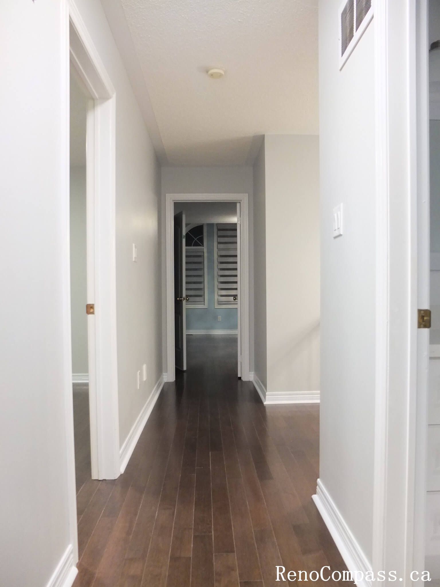 This Richmond Hill interior renovation features a refreshed hallway with rich hardwood flooring, smooth neutral wall finishes, and clean modern trim detailing. Completed by a trusted Toronto renovation company, the upgrade improves visual flow and brightness throughout the home while creating a polished and cohesive connection between living spaces.