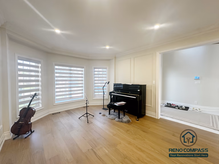 This image highlights a stair renovation completed in North York, focusing on the integration of a curved staircase within an open living space. The staircase serves as a key transitional element between floors, connecting surrounding areas while maintaining visual flow and balance. Clean wall detailing, recessed lighting, and open sightlines complement the stair design without altering the existing flooring. This renovation emphasizes precise stair craftsmanship and thoughtful spatial coordination within North York homes.