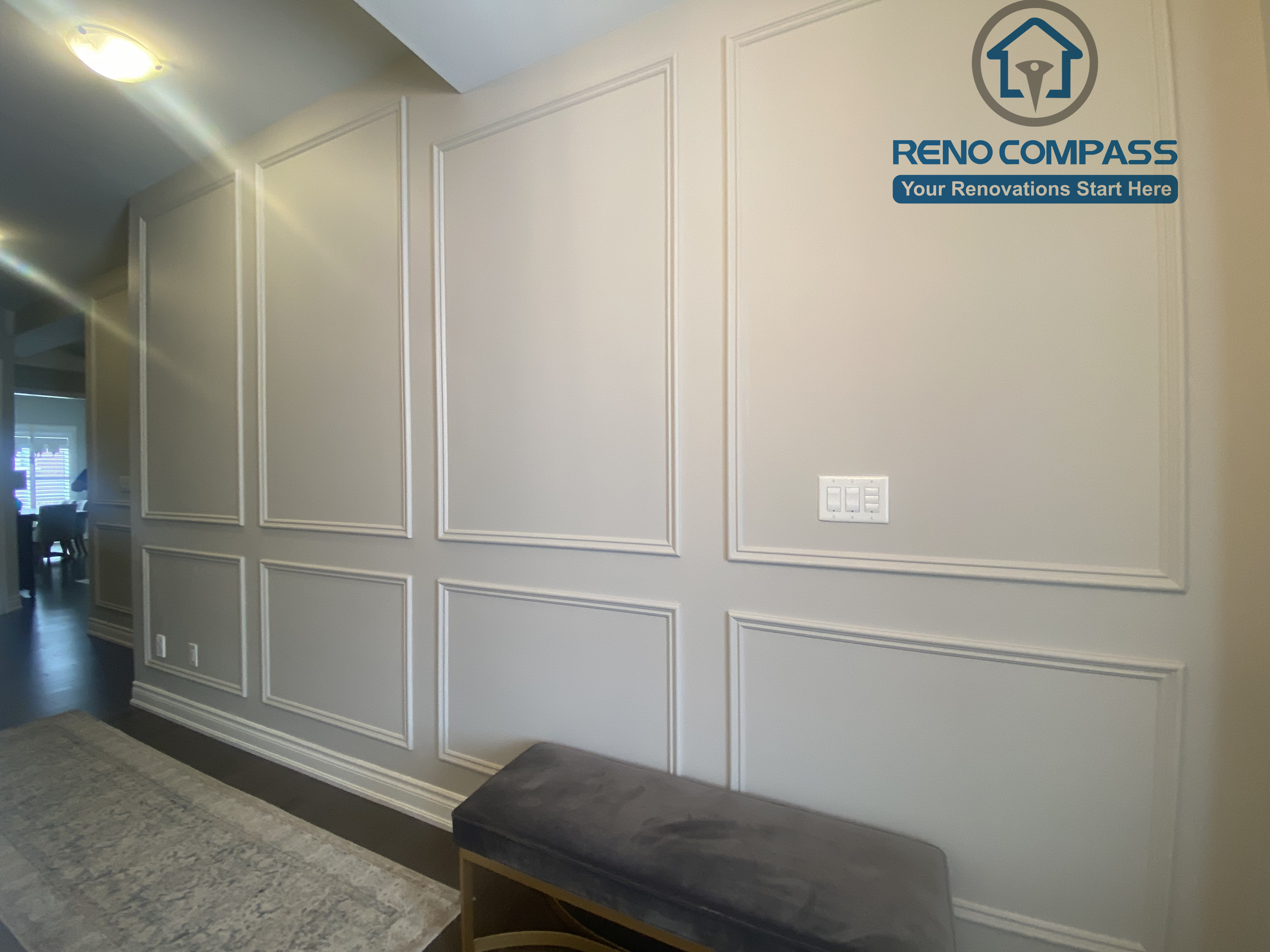 This Vaughan interior renovation features a refined hallway with custom wall paneling, clean trim details, and a long, well-proportioned layout. Subtle lighting and classic millwork enhance the sense of depth and elegance, completed by a professional Toronto renovation company.
