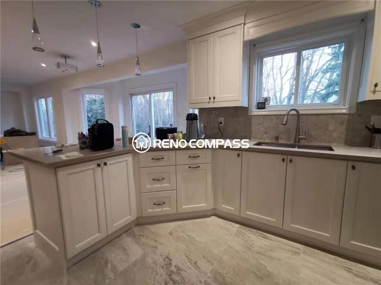 This open-concept kitchen renovation in Markham features custom cabinetry, durable countertops, and a functional peninsula layout designed for modern family living. Large windows bring in natural light, enhancing the bright and welcoming atmosphere, while upgraded lighting fixtures add depth and warmth to the space. Completed by a professional Toronto renovation company, this kitchen upgrade focuses on practical workflow, increased storage, and timeless finishes, making it ideal for homeowners looking to improve both functionality and everyday comfort.