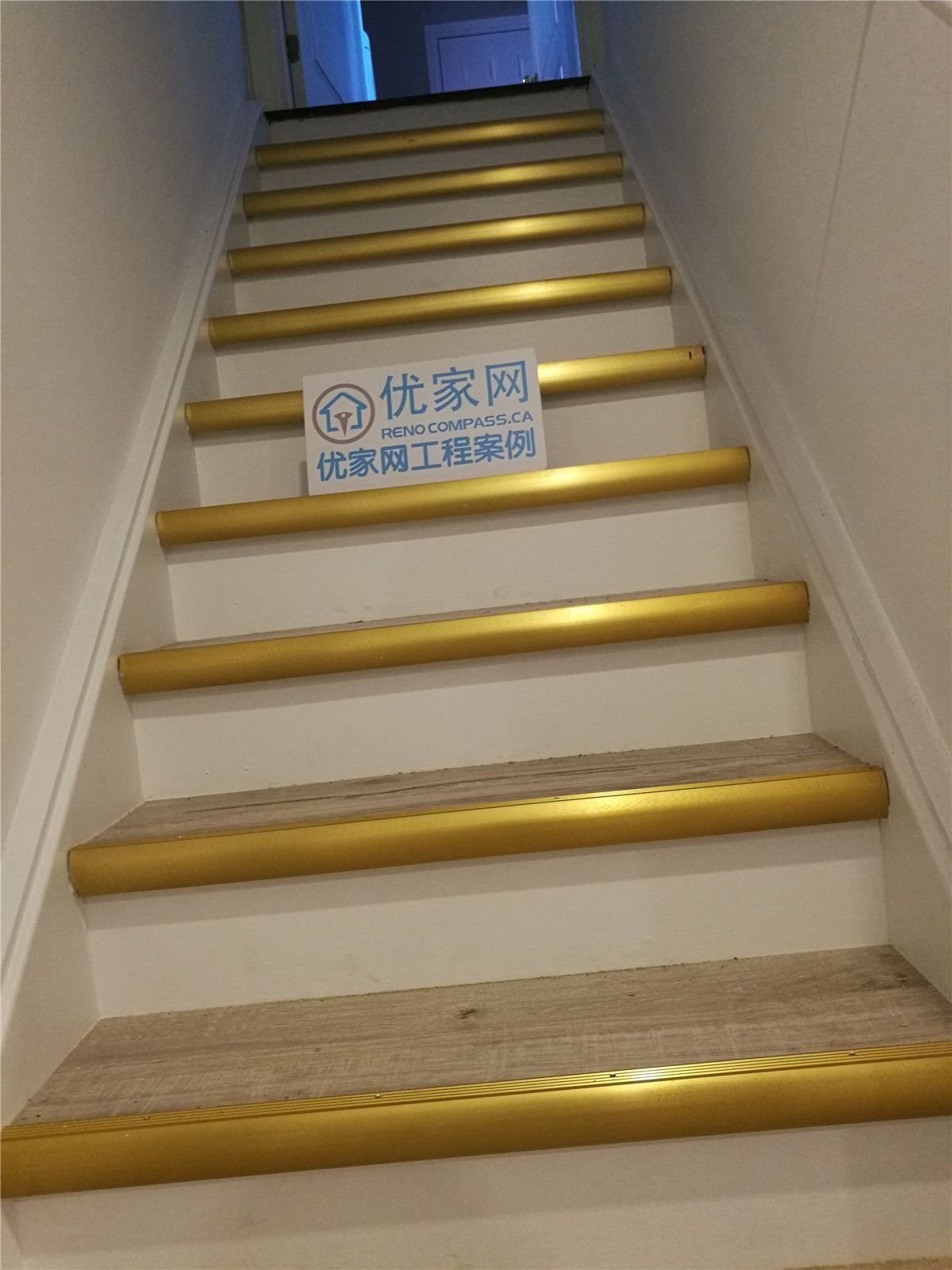 Staircase upgrade as part of a Richmond Hill interior renovation, featuring updated stair treads with gold safety nosing for improved visibility and slip resistance. This stair renovation was completed by a professional Toronto renovation company, enhancing safety, durability, and overall functionality of the home.