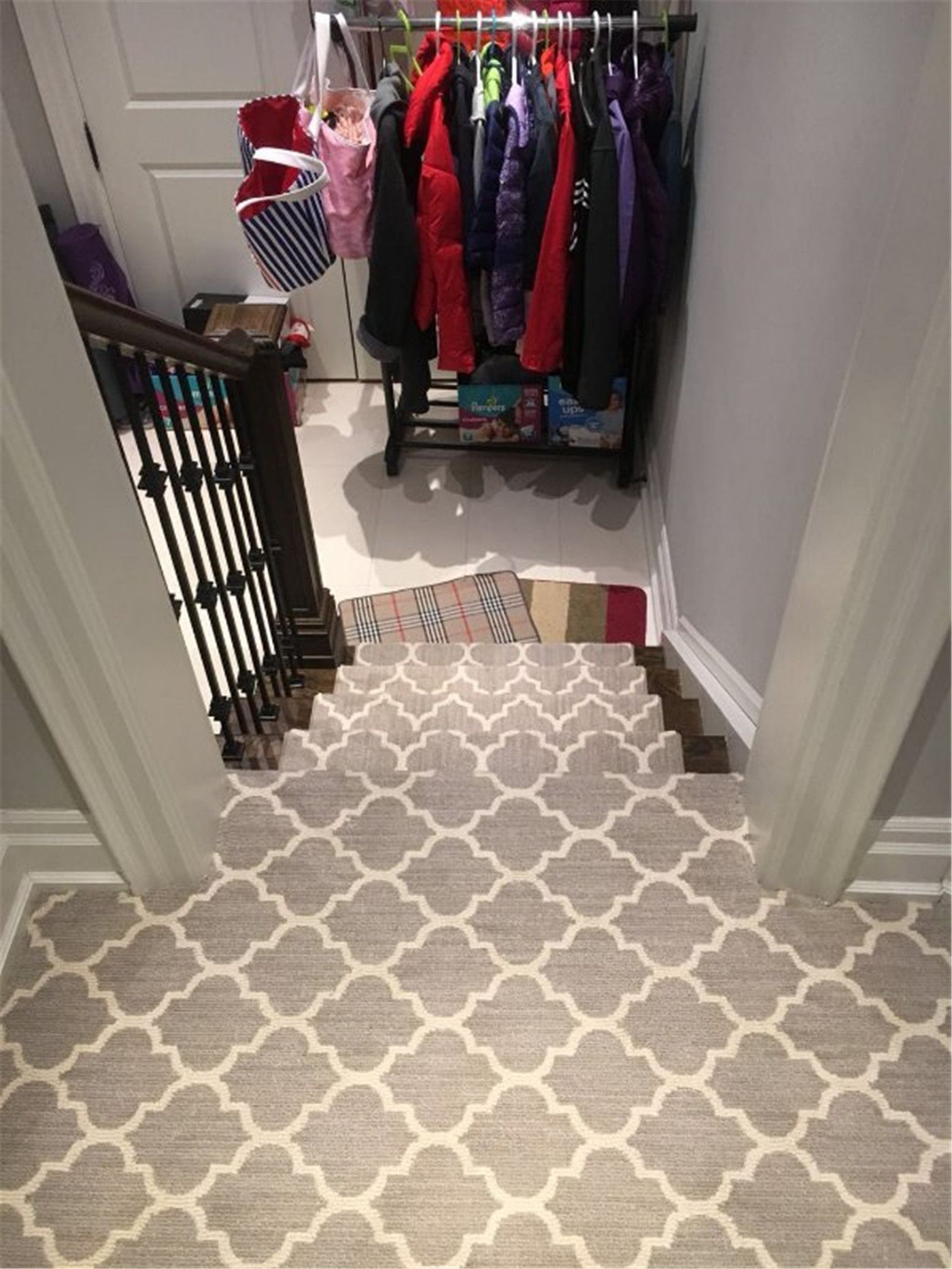 This Toronto interior carpet renovation project showcases a professionally installed staircase carpet runner designed to enhance comfort, safety, and style. The patterned carpet was custom-cut and fitted to align precisely with each stair tread, creating a clean and cohesive look from the upper level to the lower landing.

The neutral-toned runner complements the dark wood stairs and black iron railings, adding warmth while protecting high-traffic areas from wear. Installed by an experienced Toronto renovation company, this staircase carpet upgrade improves daily functionality, reduces noise, and brings a polished, modern finish to the home’s interior stairway.