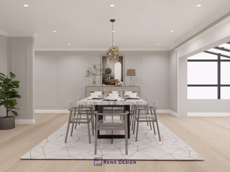 This image presents a full view of the dining room in a Toronto bungalow interior design project, featuring a centrally placed dining table, coordinated seating, and a sculptural pendant light that anchors the space. Clean wall paneling, balanced symmetry, and warm wood flooring create a calm and cohesive dining environment. Designed and completed by Reno Compass, this interior reflects a refined, modern approach tailored to single-level homes in Toronto.