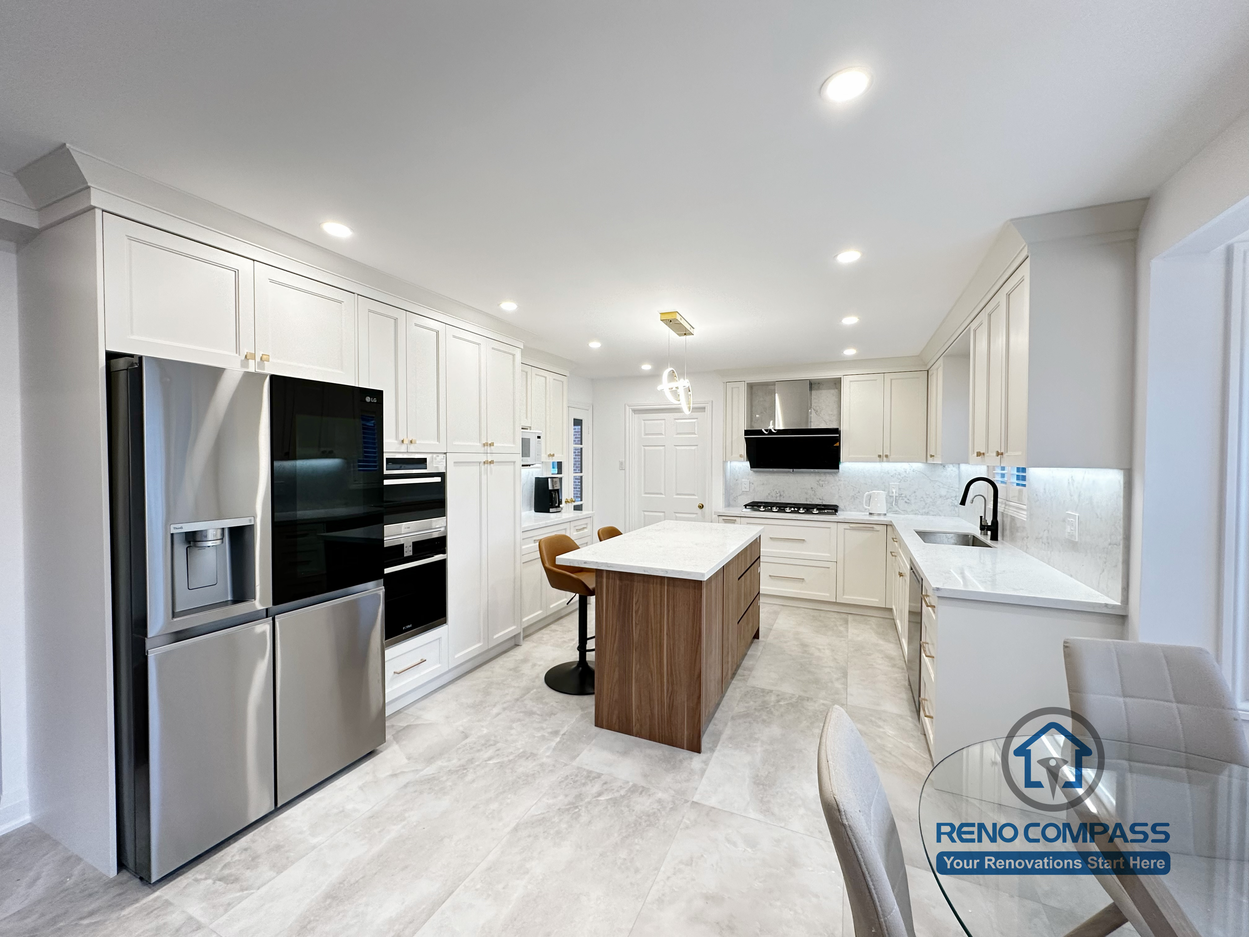 This Markham kitchen renovation showcases a spacious open-concept layout with full-height white cabinetry, integrated appliances, and a functional central island. The design emphasizes clean lines, efficient circulation, and balanced proportions, creating a bright and modern kitchen suitable for everyday family use. Completed by a professional Toronto renovation company, this project reflects a strong focus on craftsmanship, material coordination, and long-term livability.
