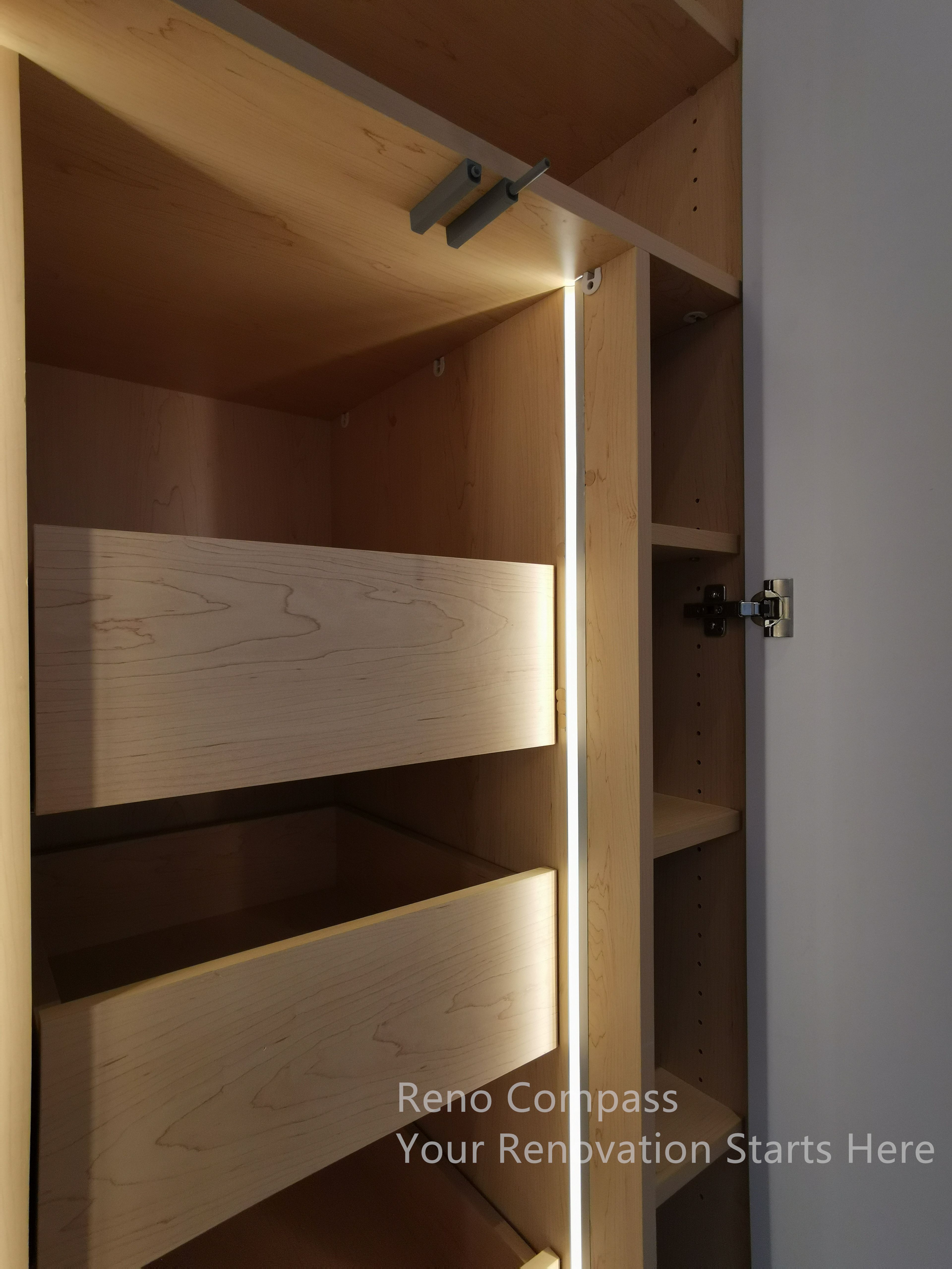 This image highlights the custom cabinetry detail completed as part of the Markham interior renovation. The interior features solid wood drawers with integrated LED lighting, enhancing visibility and everyday functionality. Clean joinery and concealed hardware reflect a focus on craftsmanship, durability, and practical storage solutions within a modern interior design framework.