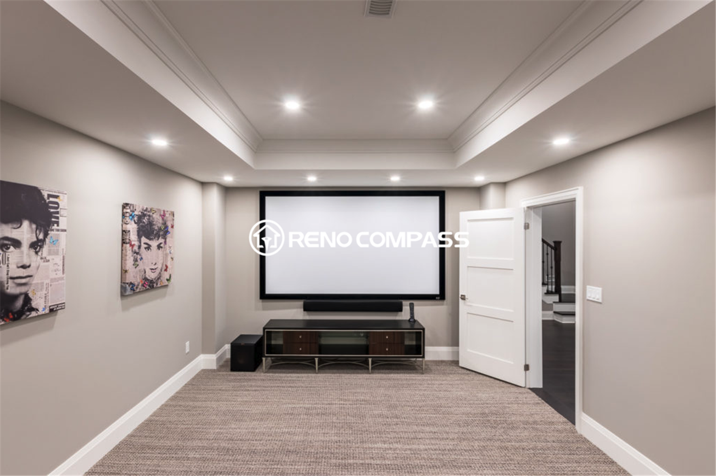 Modern luxury basement renovation in Toronto featuring a custom home theater area, recessed lighting, tray ceiling design, and premium carpeting. This professionally finished basement creates a comfortable entertainment space with elegant neutral tones and high-end detailing, completed by a trusted Toronto renovation company, Reno Compass Inc.