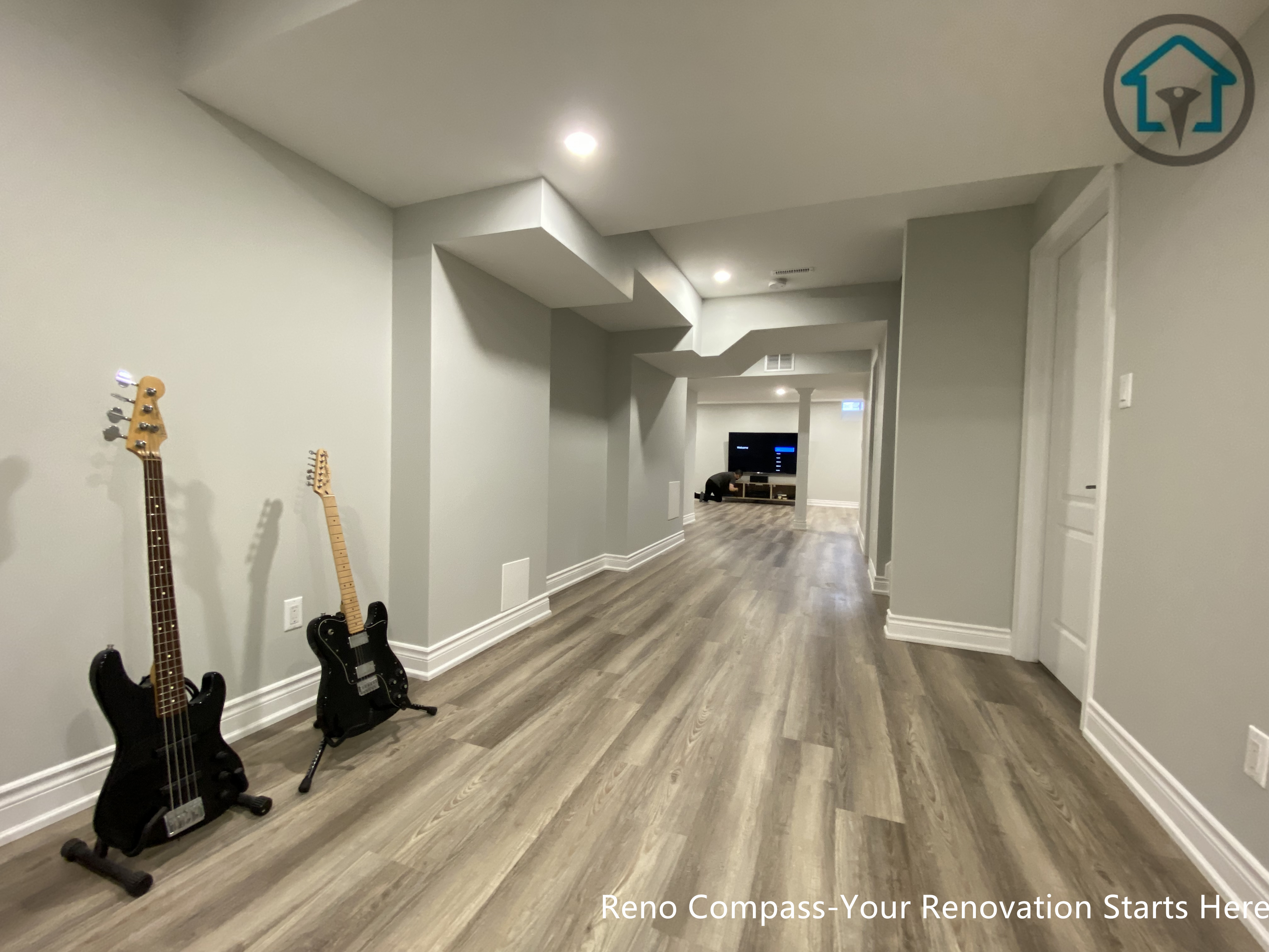 A finished basement living area in Markham featuring neutral wall tones, durable flooring, and recessed lighting, designed to create a comfortable and functional lower-level space.