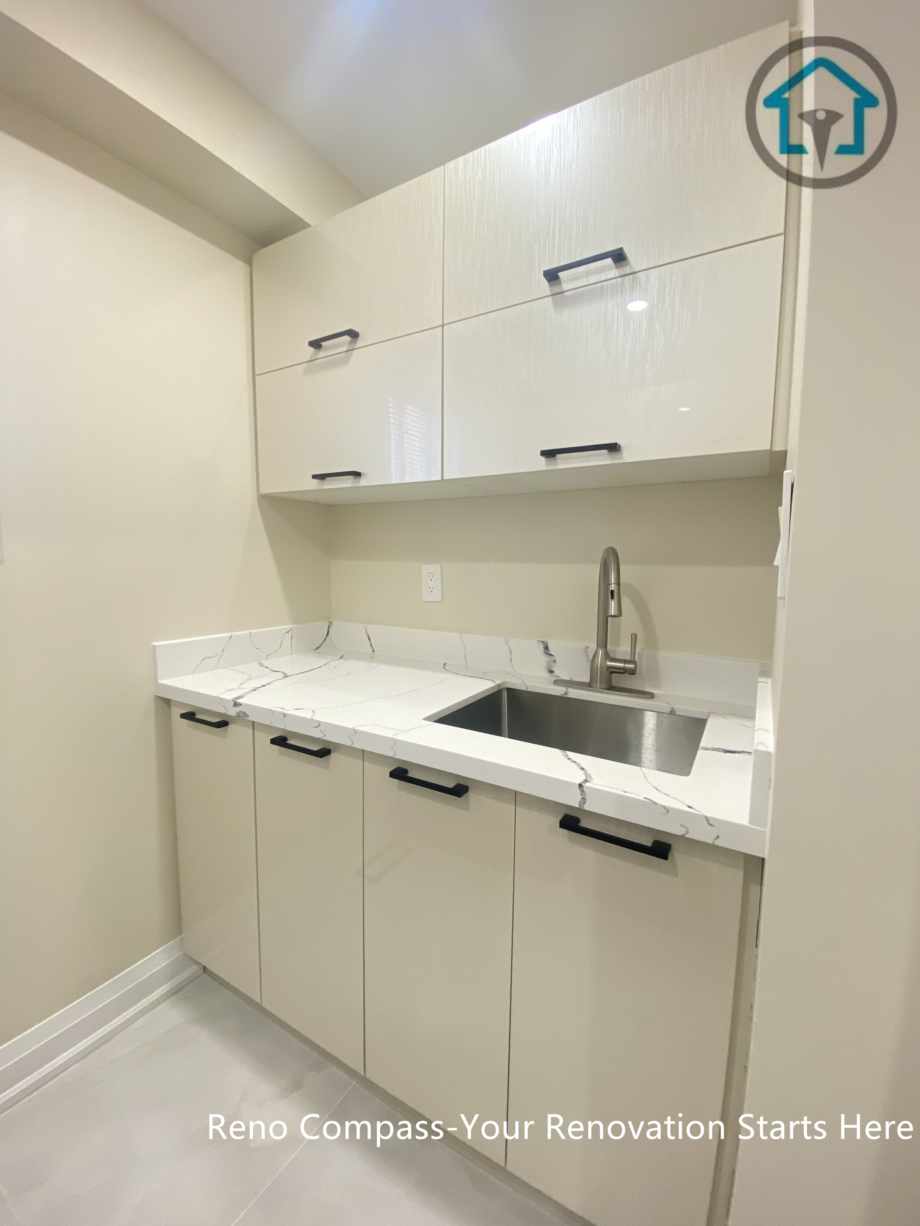 Utility kitchen area from a completed interior renovation project in Vaughan, featuring a clean and functional cabinetry layout by Reno Compass.