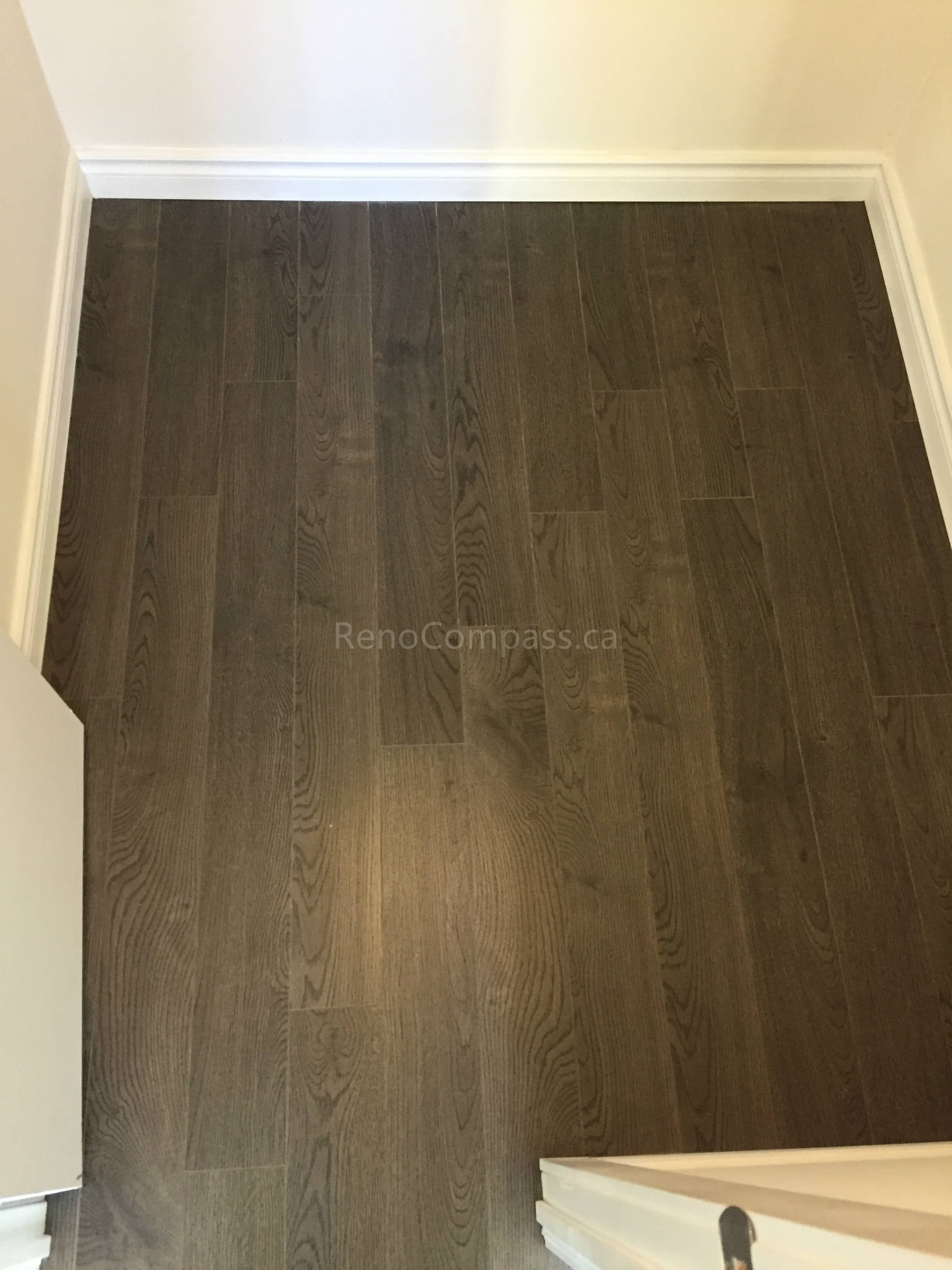 This Mississauga flooring replacement project features newly installed dark-stained solid hardwood stair treads, enhancing durability, safety, and modern appeal. The upgraded staircase creates a seamless transition between floors while adding warmth and architectural elegance to the home. Completed by a trusted Toronto Renovation Company, this stair flooring renovation improves both functionality and long-term property value.