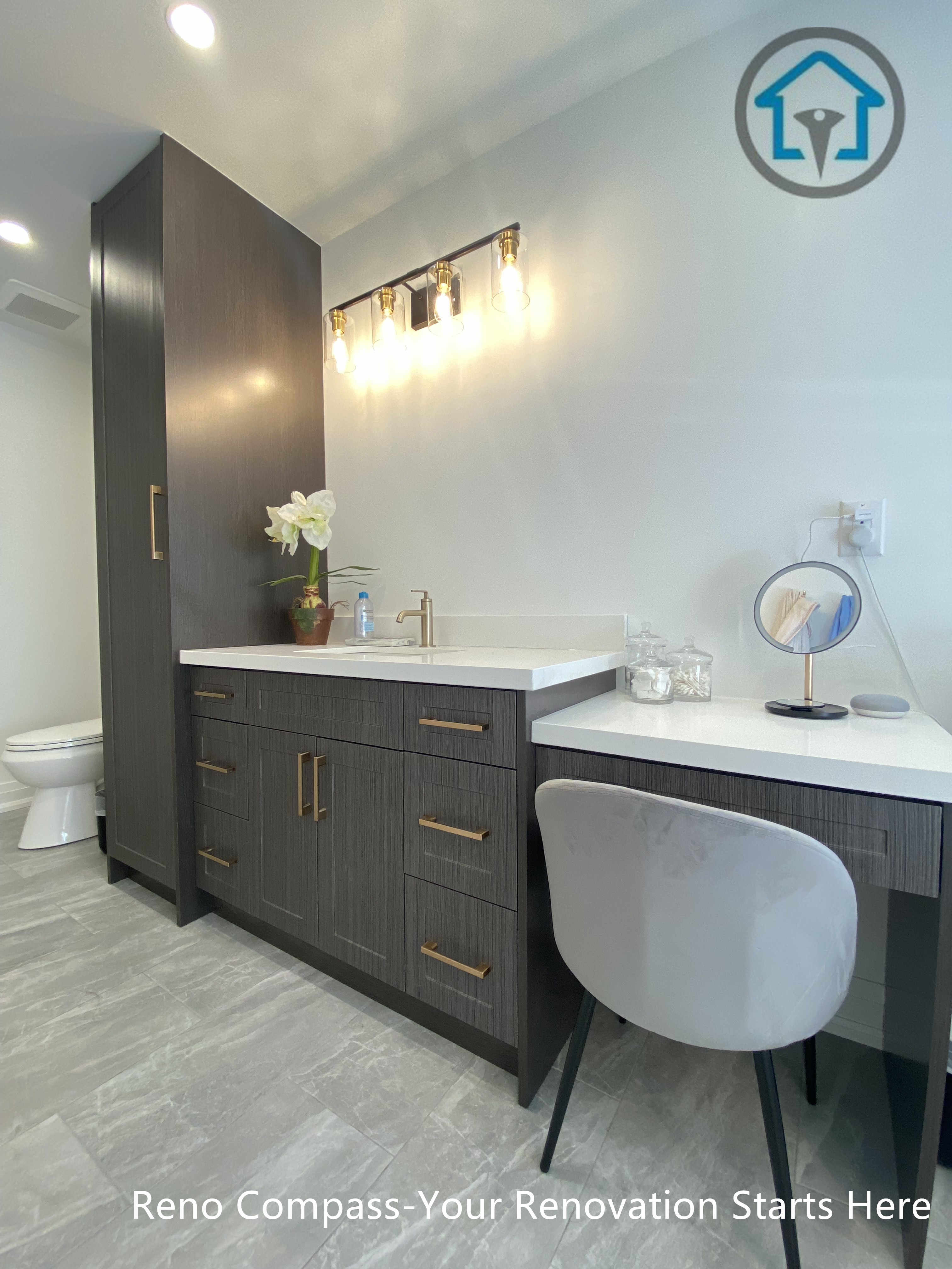 Custom vanity with integrated makeup area, textured cabinetry, quartz countertop, and warm accent lighting in a Markham bathroom renovation.