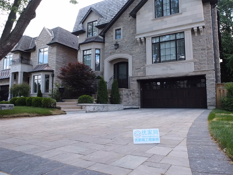 This North York landscaping renovation features a custom interlocking driveway paired with a refined front yard layout. Large-format stone pavers were installed to create a clean, durable driveway surface that complements the home’s stone façade. The design emphasizes proper grading, drainage performance, and long-term stability, while maintaining a cohesive, upscale curb appeal. This project reflects a balanced approach to landscaping renovation, combining functionality, craftsmanship, and architectural harmony for residential properties in North York.