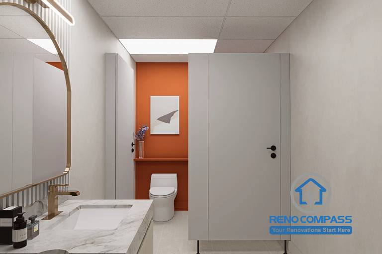 A clean and modern washroom design in a Markham medical clinic renovation, featuring a marble vanity, soft lighting, and private toilet partition to enhance hygiene and patient comfort.