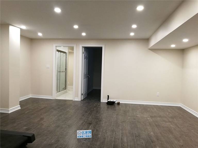 This Scarborough basement renovation showcases a newly finished open-concept living space with modern recessed lighting, durable vinyl flooring, and a clean neutral color palette. The layout connects seamlessly to a newly renovated basement bathroom, creating a comfortable and functional extension of the home. Designed for versatility, the space can be used as a family lounge, rental suite, or entertainment area. Completed by a professional Toronto renovation company, this project highlights quality craftsmanship and thoughtful basement design for modern living.