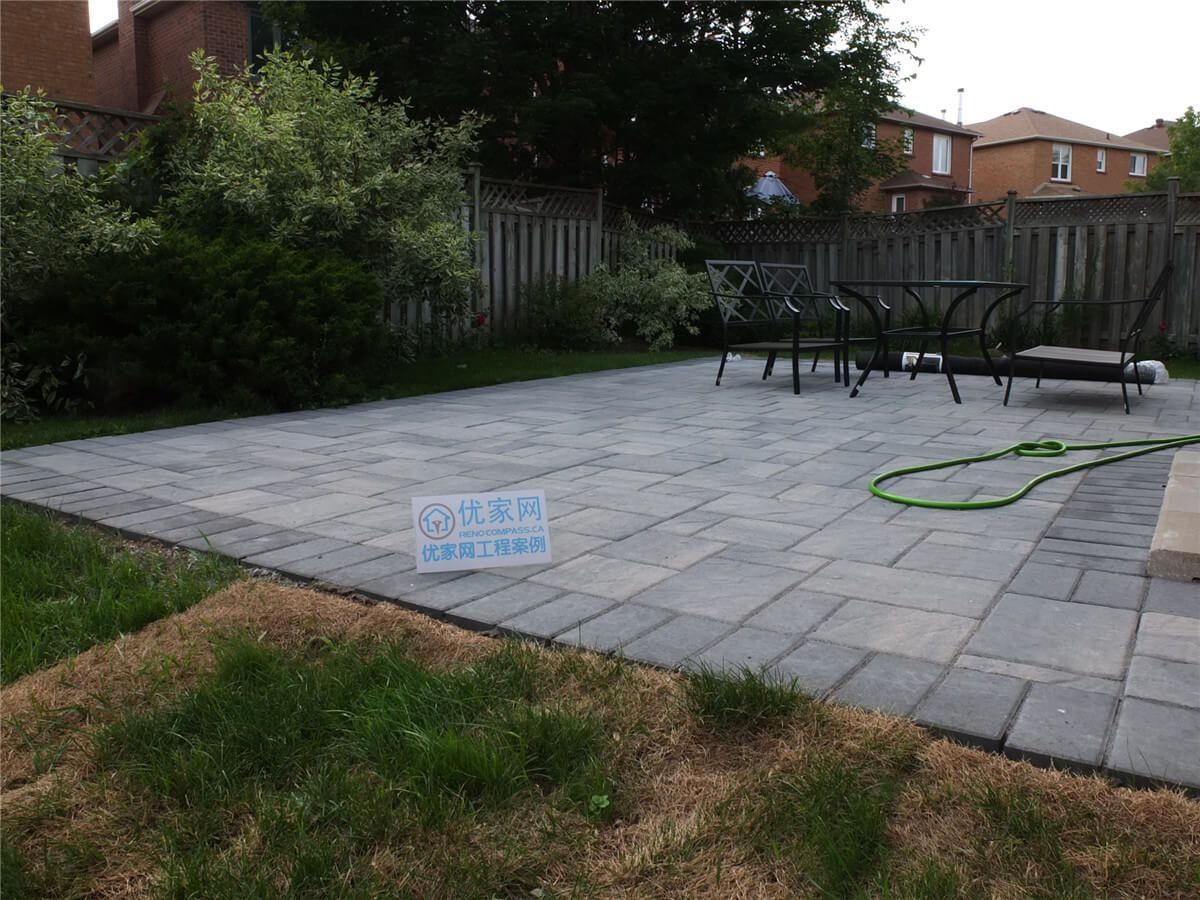 This Toronto backyard landscaping project features a professionally installed interlocking stone patio with a clean, modern layout. The new outdoor space provides a durable and stylish seating area, surrounded by refreshed lawn and greenery for a functional and inviting backyard environment. Completed by Reno Compass, this project highlights quality craftsmanship in patio construction and garden landscaping for Toronto homeowners seeking beautiful and low-maintenance outdoor living spaces.