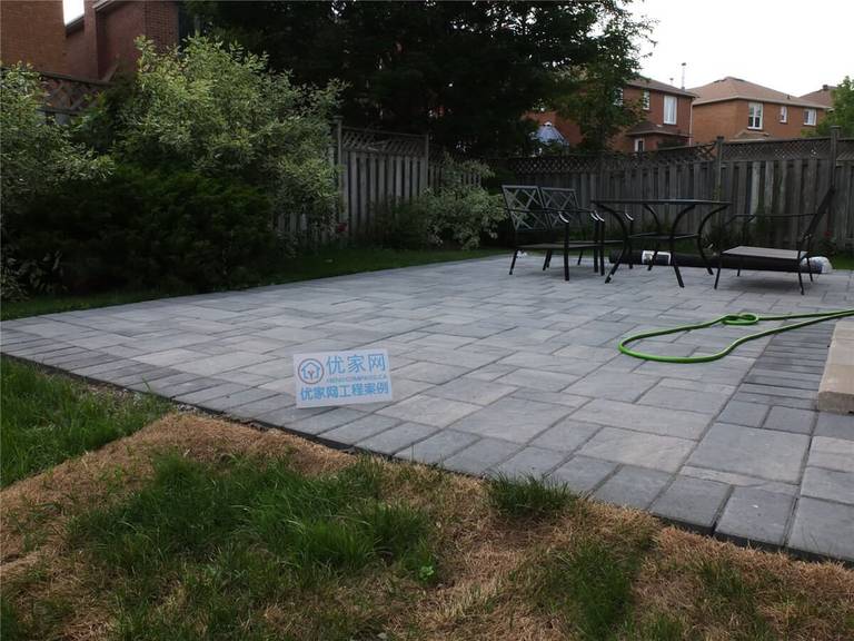 This Toronto backyard landscaping project features a professionally installed interlocking stone patio with a clean, modern layout. The new outdoor space provides a durable and stylish seating area, surrounded by refreshed lawn and greenery for a functional and inviting backyard environment. Completed by Reno Compass, this project highlights quality craftsmanship in patio construction and garden landscaping for Toronto homeowners seeking beautiful and low-maintenance outdoor living spaces.