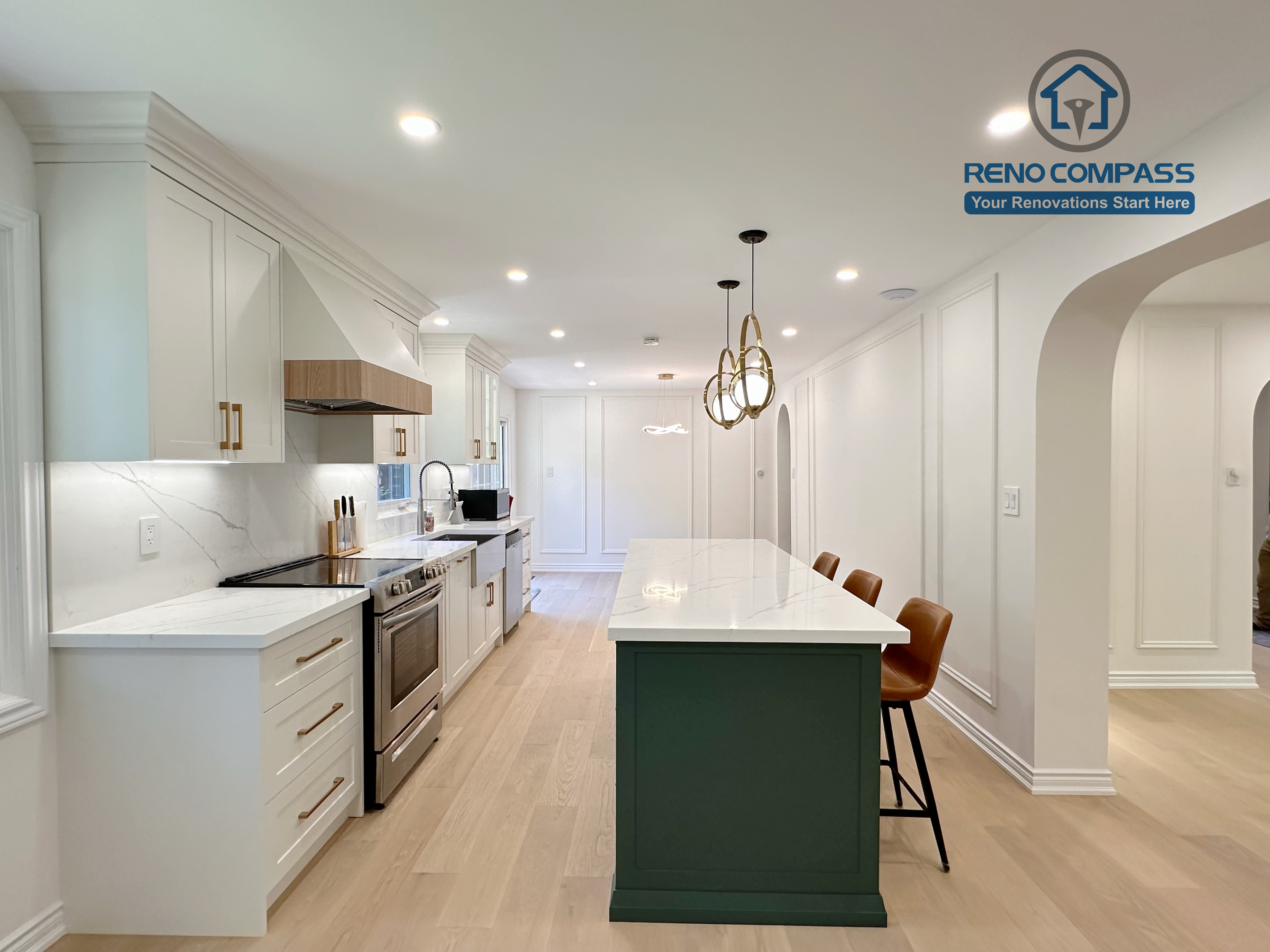 This Markham kitchen renovation features an open-concept layout centered around a custom green island with quartz countertops and seating. White cabinetry, brass hardware, and stainless steel appliances create a clean and cohesive design, while recessed lighting and wide-plank hardwood flooring enhance brightness and flow. Completed by a professional Toronto renovation company, Reno Compass Inc., the kitchen is designed for everyday functionality and long-term comfort.