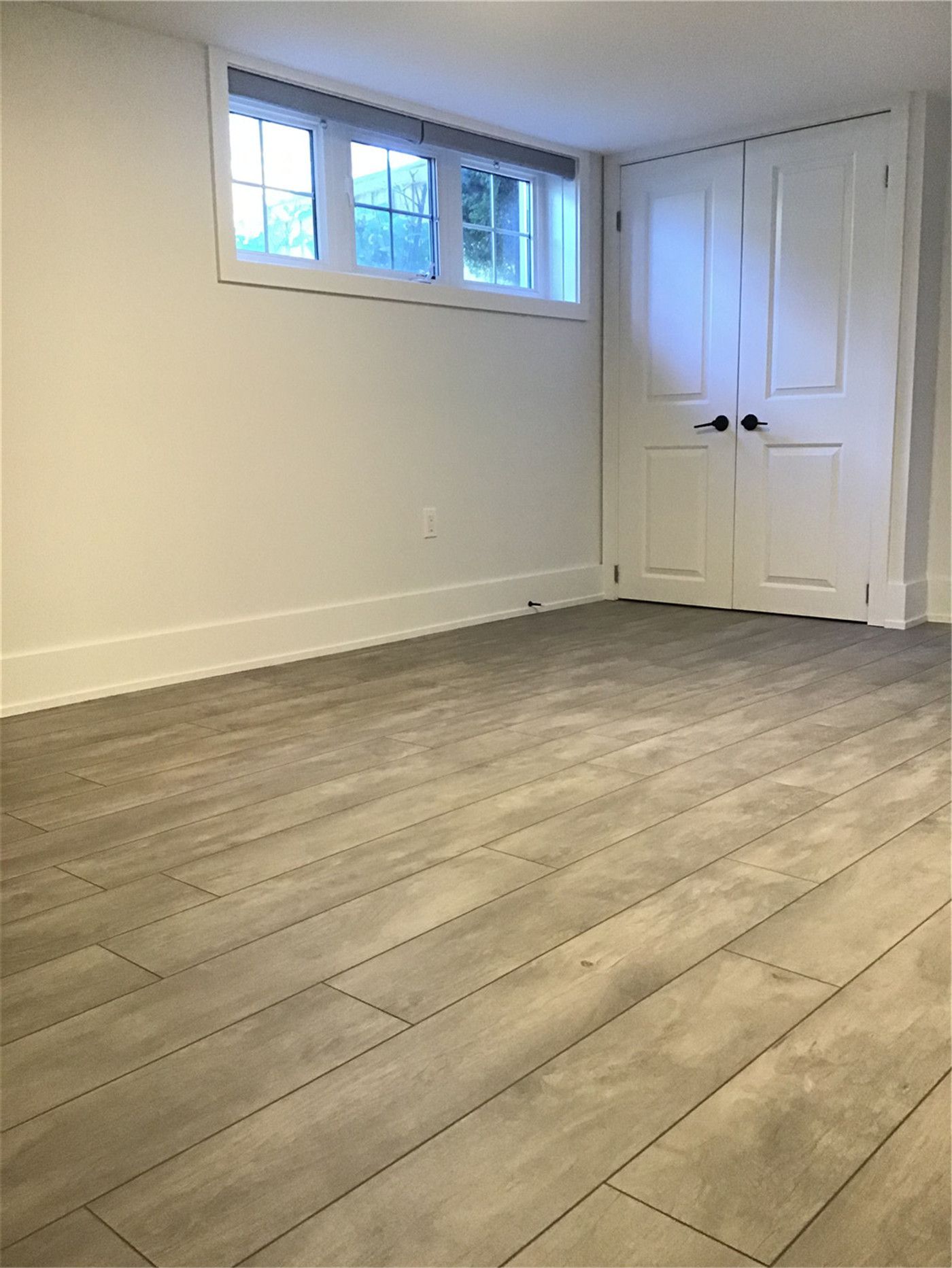 This Markham full home renovation highlights high-quality wood-look vinyl plank flooring with a natural grain texture and durable finish. The seamless installation enhances continuity throughout the space while providing long-lasting performance and easy maintenance. Completed by a trusted Toronto Renovation Company, this flooring solution combines aesthetic appeal with everyday practicality.