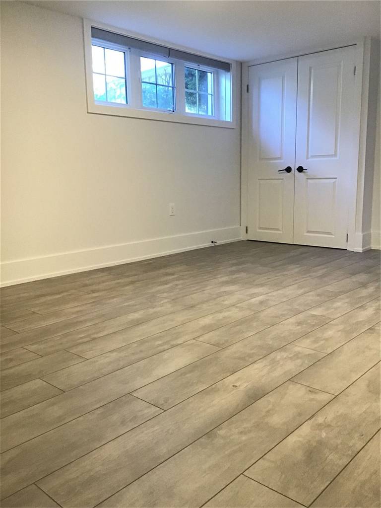 This Markham full home renovation highlights high-quality wood-look vinyl plank flooring with a natural grain texture and durable finish. The seamless installation enhances continuity throughout the space while providing long-lasting performance and easy maintenance. Completed by a trusted Toronto Renovation Company, this flooring solution combines aesthetic appeal with everyday practicality.
