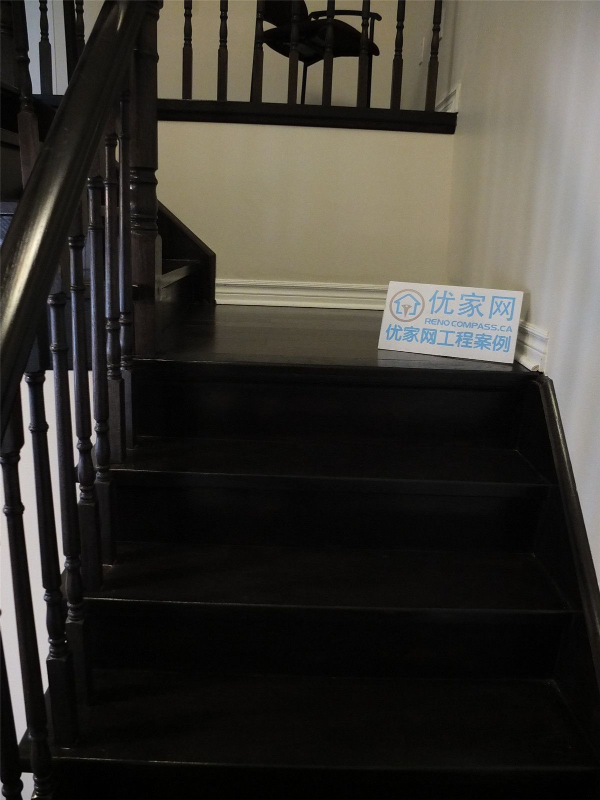 This image highlights the staircase flooring installation as part of a whole house flooring project in Markham. Dark hardwood stair treads are carefully installed to match the main floor, creating a seamless transition between levels. The clean edges, consistent wood tone, and precise craftsmanship enhance both safety and visual continuity, demonstrating professional flooring installation for residential homes in the Greater Toronto Area.