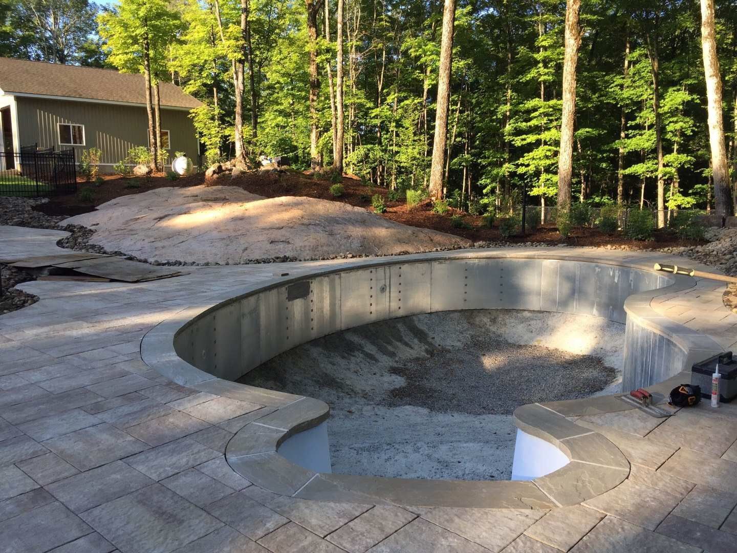 Custom backyard swimming pool construction in Toronto featuring professional steel pool structure installation and foundation preparation. This stage highlights precise pool framing, base leveling, and site grading to ensure long-term durability and structural stability for a high-quality residential swimming pool project.