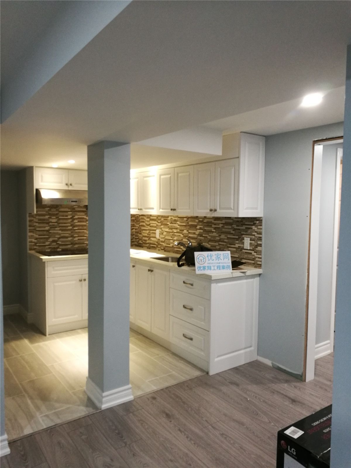 This image features a finished interior area with vinyl plank flooring and neutral finishes as part of a North York interior renovation project. The durable flooring and simple design make the space suitable for flexible use, including living, working, or storage purposes. The renovation focuses on long-term performance and clean detailing.