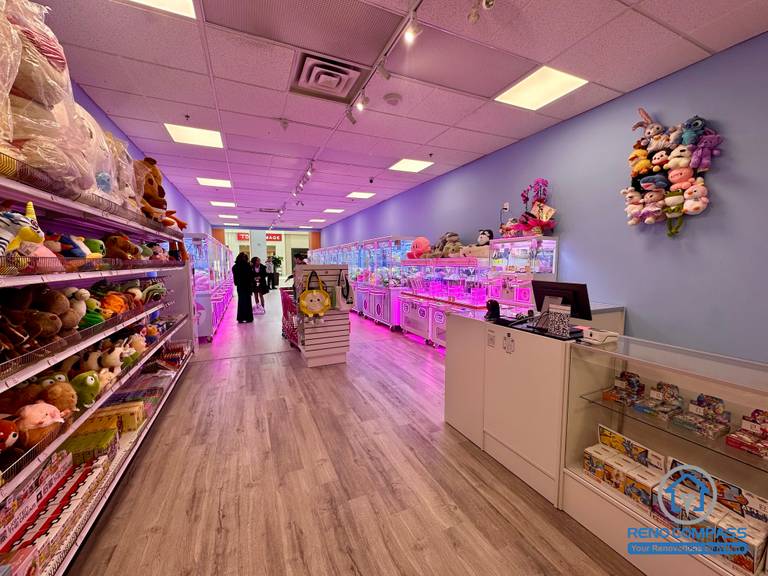 Commercial renovation of an arcade claw machine and game store inside Oakville Place Mall. The layout combines arcade gaming, prize display, and indoor playground-style entertainment space design.