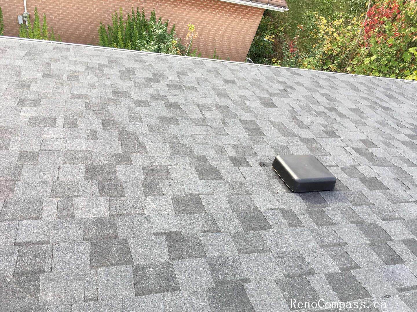This image captures the mid-stage of a roofing replacement project in Toronto, showing newly installed roof decking and waterproof underlayment preparation. The old roofing materials have been removed to expose the wooden roof structure, allowing the team to reinforce the base and ensure proper alignment before installing new shingles. High-quality waterproof membrane layers are applied to enhance moisture protection and improve long-term durability against Toronto’s harsh weather conditions. This professional roofing replacement process ensures structural integrity, proper insulation support, and a reliable foundation for the final roofing system installation on residential properties.