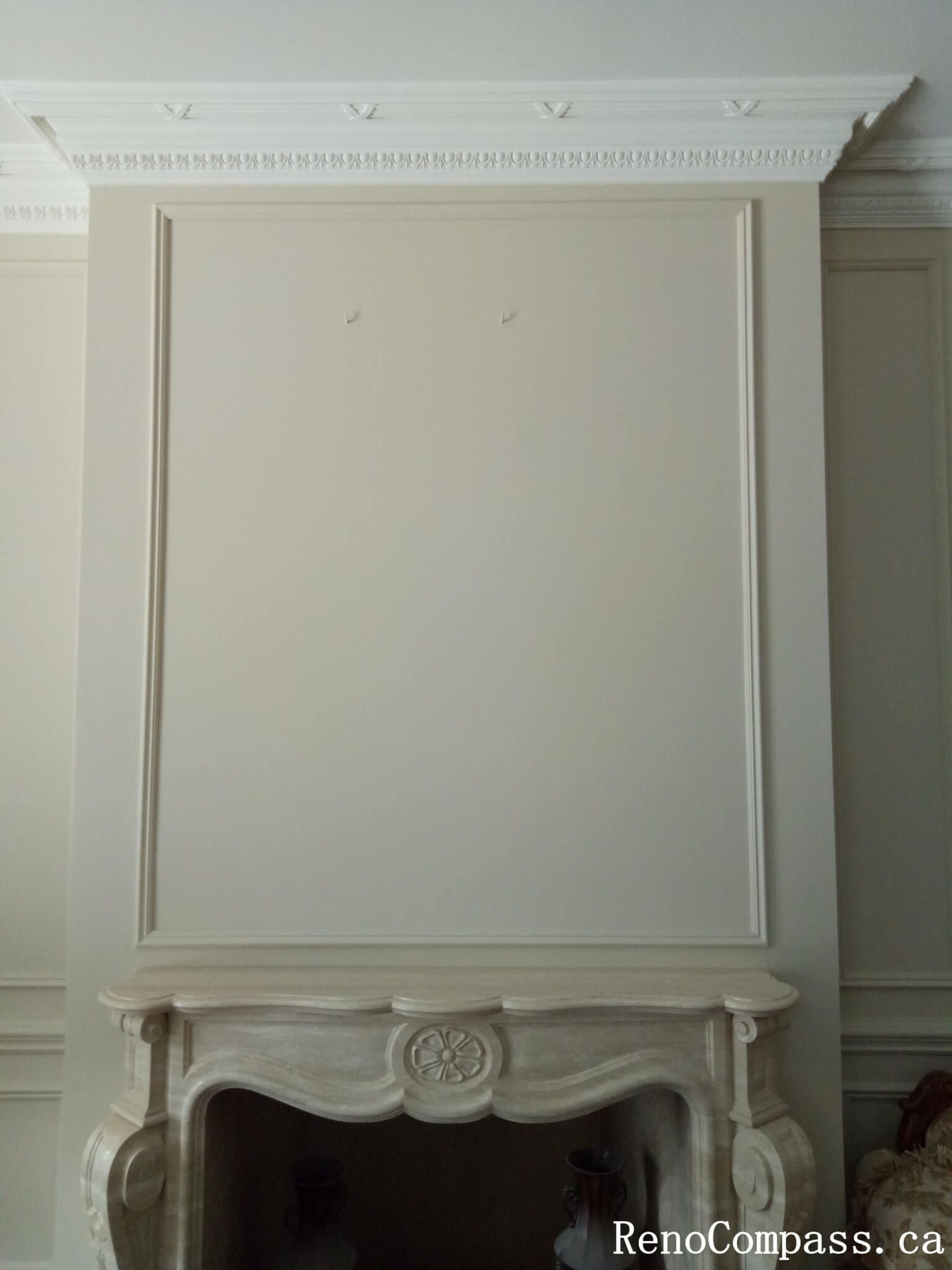 This image showcases a refined interior painting project in North York, featuring custom wall panel molding, elegant crown molding, and a soft neutral color palette. The freshly painted decorative wall panels create depth and symmetry, enhancing the overall brightness and sophistication of the space. Precise surface preparation and clean finishing ensure smooth lines and a high-end result, ideal for modern and classic home interiors. This North York painting project highlights professional craftsmanship and attention to architectural details, delivering a timeless and polished interior look.