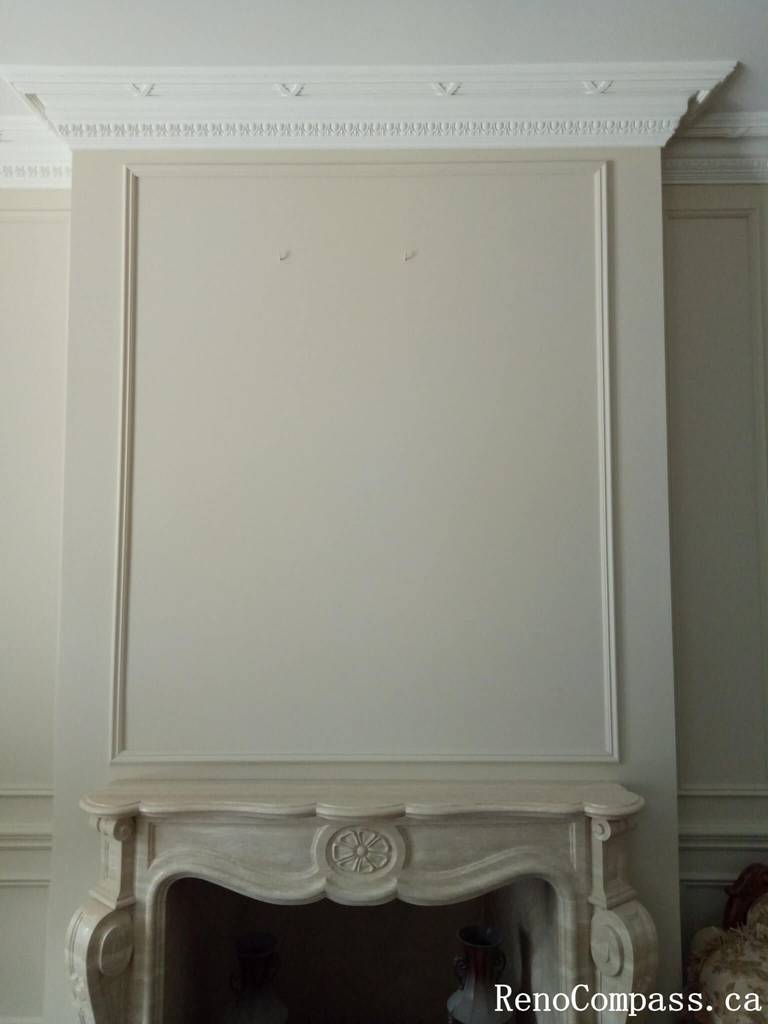 This image showcases a refined interior painting project in North York, featuring custom wall panel molding, elegant crown molding, and a soft neutral color palette. The freshly painted decorative wall panels create depth and symmetry, enhancing the overall brightness and sophistication of the space. Precise surface preparation and clean finishing ensure smooth lines and a high-end result, ideal for modern and classic home interiors. This North York painting project highlights professional craftsmanship and attention to architectural details, delivering a timeless and polished interior look.