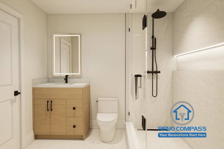 Contemporary bathroom design developed for a Markham whole home renovation project. Featuring a custom wood vanity, quartz countertop, illuminated mirror, frameless glass shower enclosure, and matte black fixtures. The clean layout maximizes functionality while creating a bright, modern, and spa-inspired atmosphere.